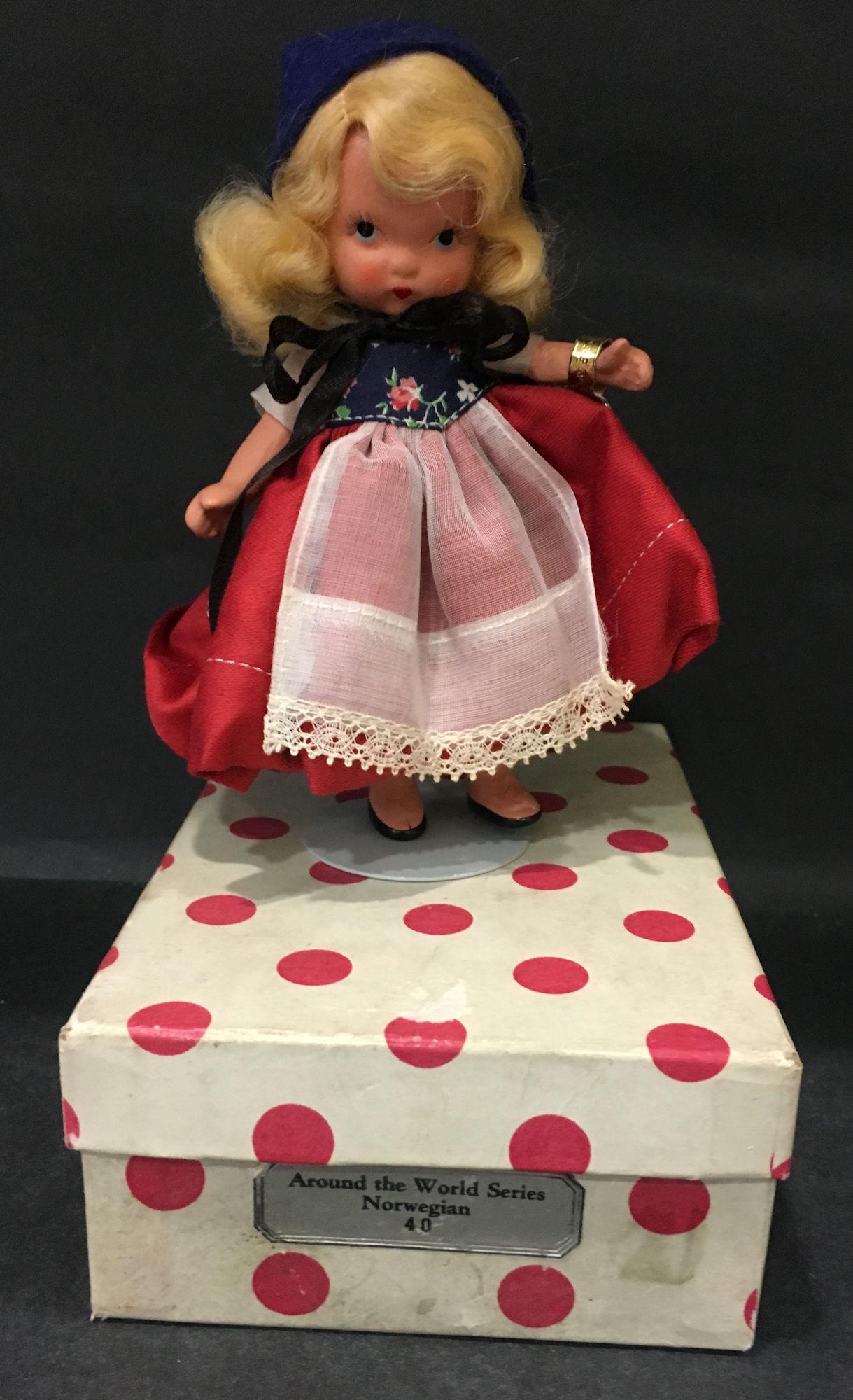 5½" STORYBOOK DOLL AROUND THE WORLD SERIES: 5½" STORYBOOK DOLL AROUND THE WORLD SERIES "NORWEGIAN" #40 IN ORIGINAL COSTUME. "STORY BOOK DOLL USA" MARK ON JOINTED PT BISQUE BODY WEARING GOLD FOIL WRIST TAG AND LABEL ON HAT "NANCY ANN 100%