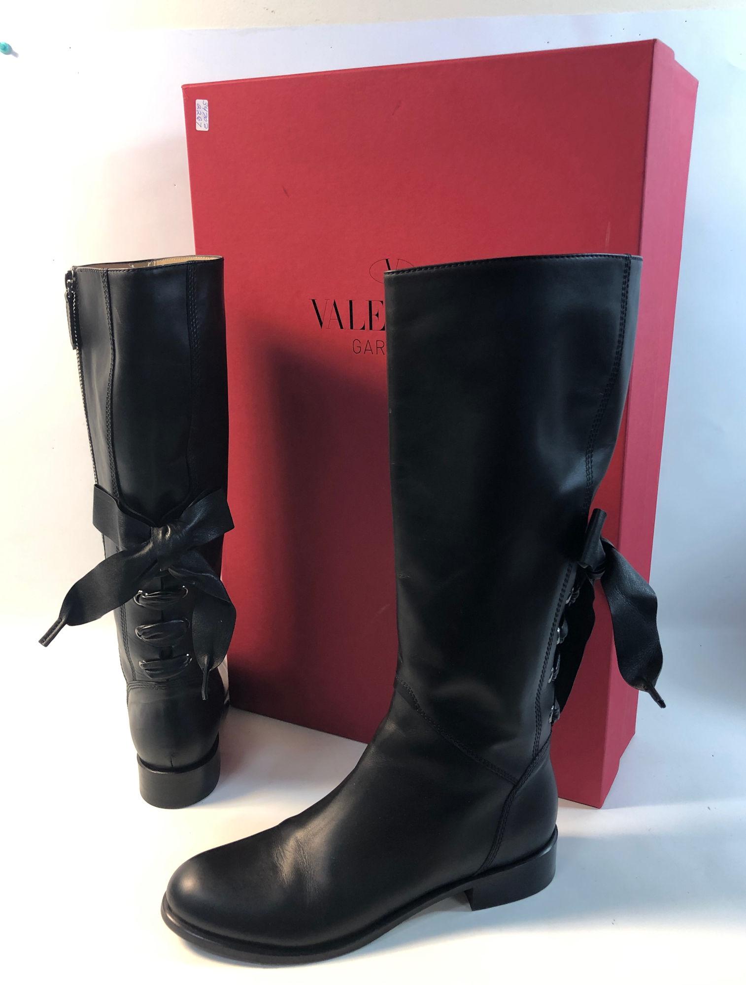 VALENTINO GARAVANI LEATHER BOOTS: VALENTINO GARAVANI LEATHER BOOTS ~ VERY GENTLY USED, SIZE 40 EU, BLACK LEATHER BOOTS, ZIPPED CLOSURE, SILVER TONE HARDWARE WITH GUN METAL OVERTONES, LEATHER BOW, LACE UP DETAILING ON BACK, NO. VF 238 