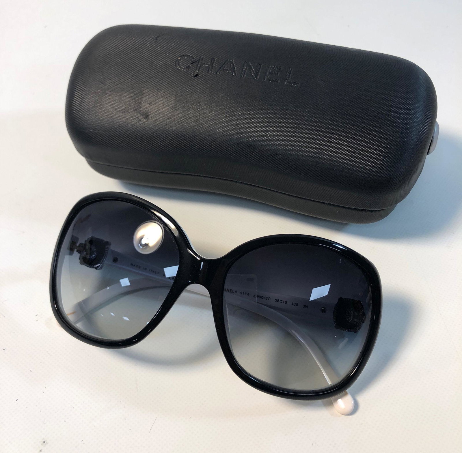 CHANEL SUNGLASSES: CHANEL SUNGLASSES ~ WHITE FRAMES WITH BLACK OVERLAY, SILVER TONE DOUBLE C ACCENTS WITH BLACK ENAMEL INLAY AND CLEAR RESIGN OVERLAY, IN BRANDED BOX, STYLE NO. 5174, ITALIAN MADE, BRANDED TRAVEL POUCH A