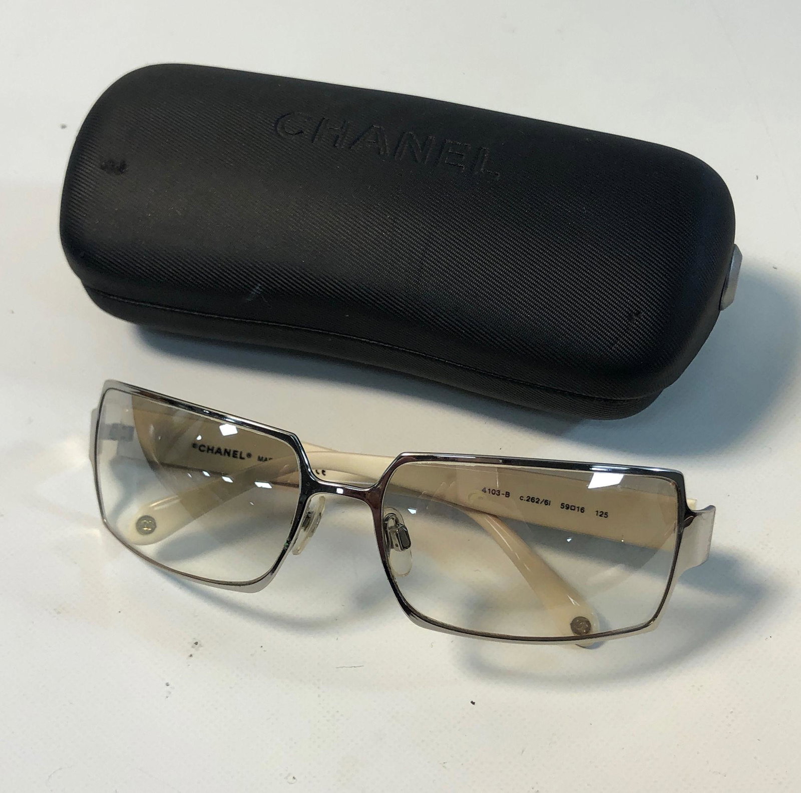 CHANEL EVENING SUNGLASSES: CHANEL EVENING SUNGLASSES ~ SILVER TONE FRAMES, CREAM ARMS FEATURING QUILTED PATTERN WITH RHINESTONE ACCENTS-SOME RHINESTONES SHOW DISCOLORATION, NO. 4103-B, IN BRANDED CASE