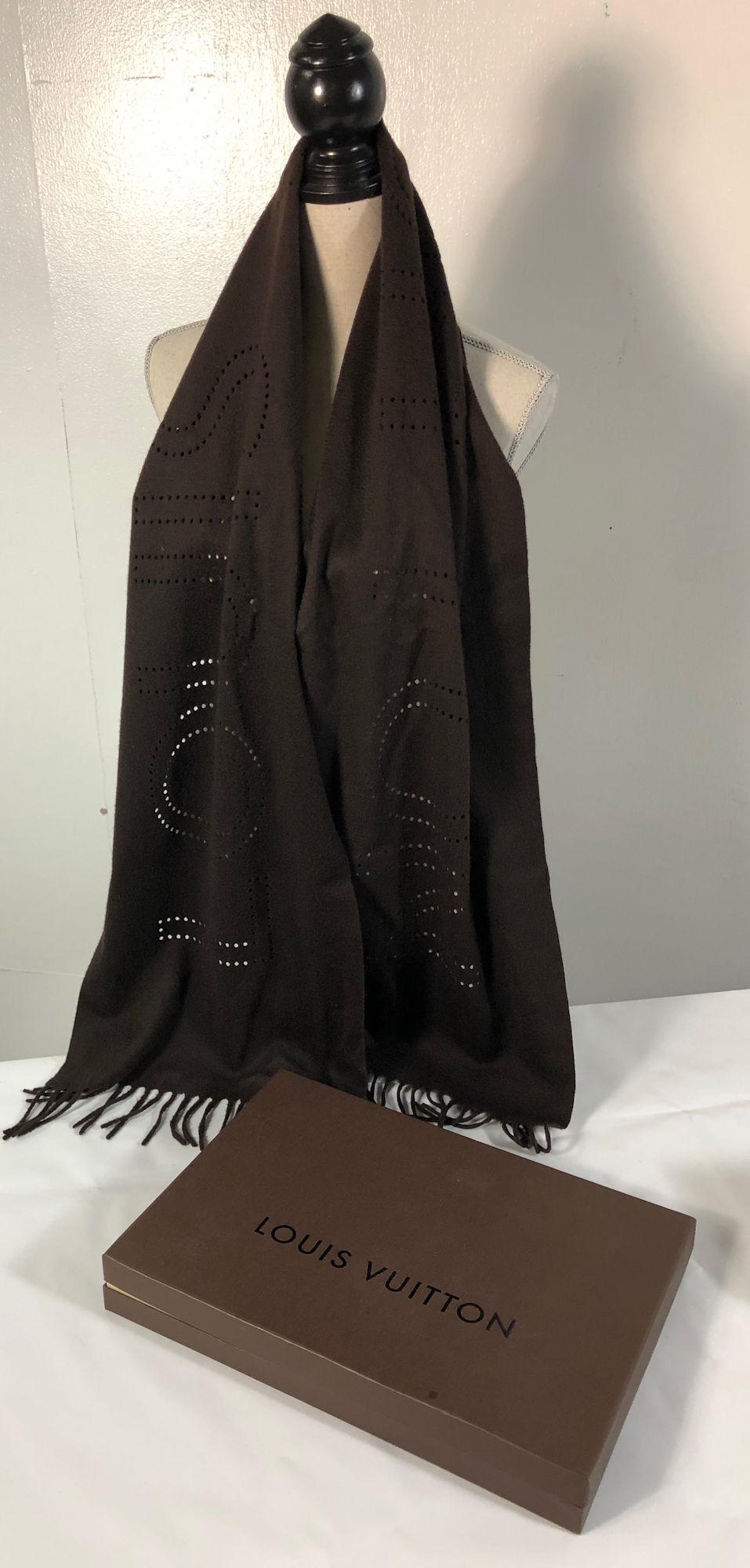 LOUIS VUITTON CASHMERE SCARF: LOUIS VUITTON CASHMERE SCARF ~ BROWN CASHMERE SCARF, LIKE NEW CONDITION, ITALIAN MADE, DIE CUT/PUNCHED LOGO, TASSLED ENDS, APPROX. 72" X 15" ORIGINAL BOX & TRAVEL BAG INCLUDED