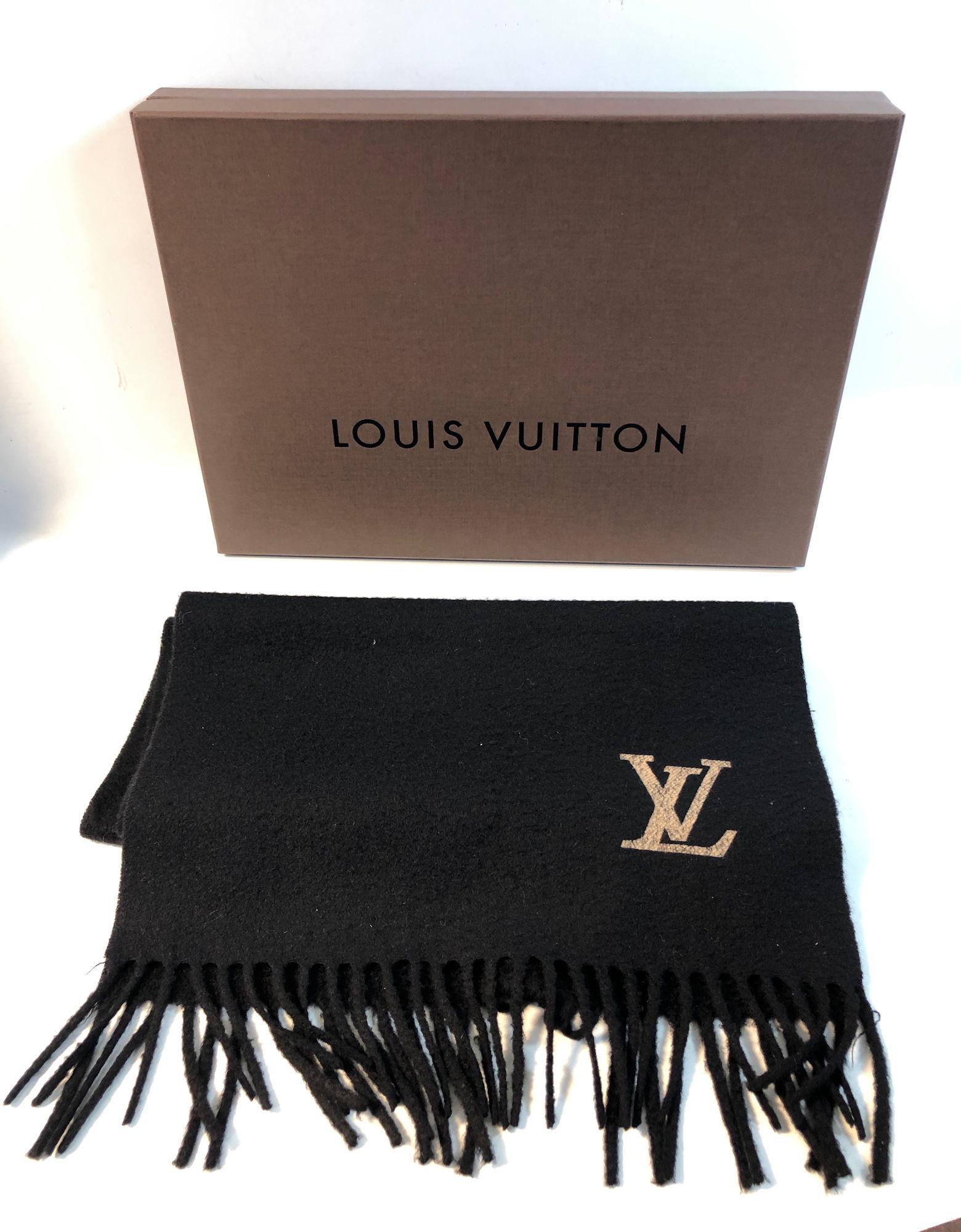 LOUIS VUITTON CASHMERE SCARF: LOUIS VUITTON CASHMERE SCARF ~ ITALIAN MADE BLACK CASHMERE, TASSLED ENDS, EMBROIDERED LV LOGO, APPROX. 60" X 14" NO. 400788, LIKE NEW CONDITION WITH ONE LOOSE STRING, IN ORIGINAL BOX