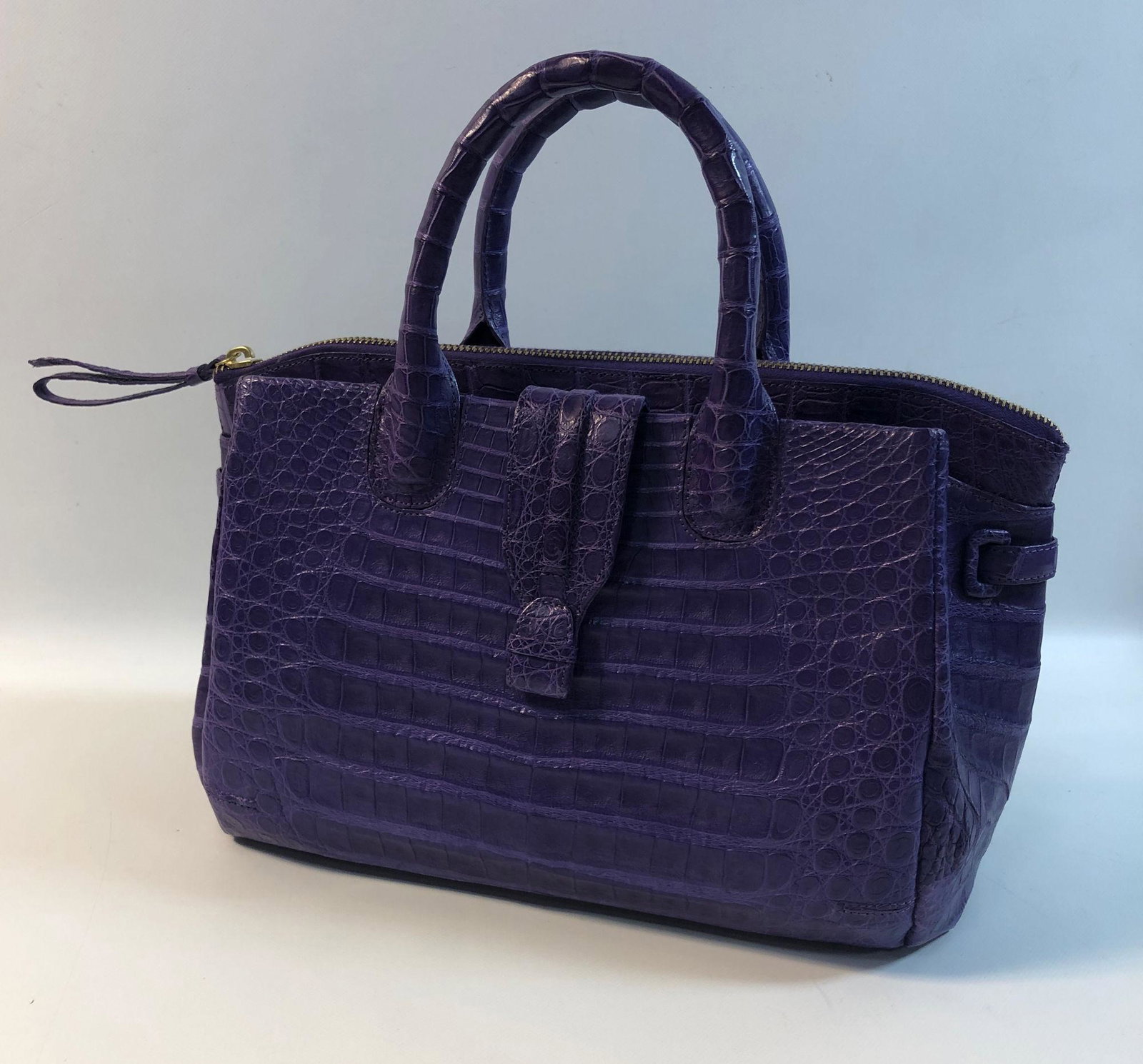 NANCY GONZALEZ HANDBAG: NANCY GONZALEZ HANDBAG ~ CRISTINA STYLE, PURPLE CROCODILE TOTE BAG, LIKE NEW CONDITION, GOLD TONE HARDWARE, PURPLE SUEDE INTERIOR, DETACHABLE SHOULDER STRAP, APPROX. 7.5" HEIGHT, SELF-COVERED PROTECTE