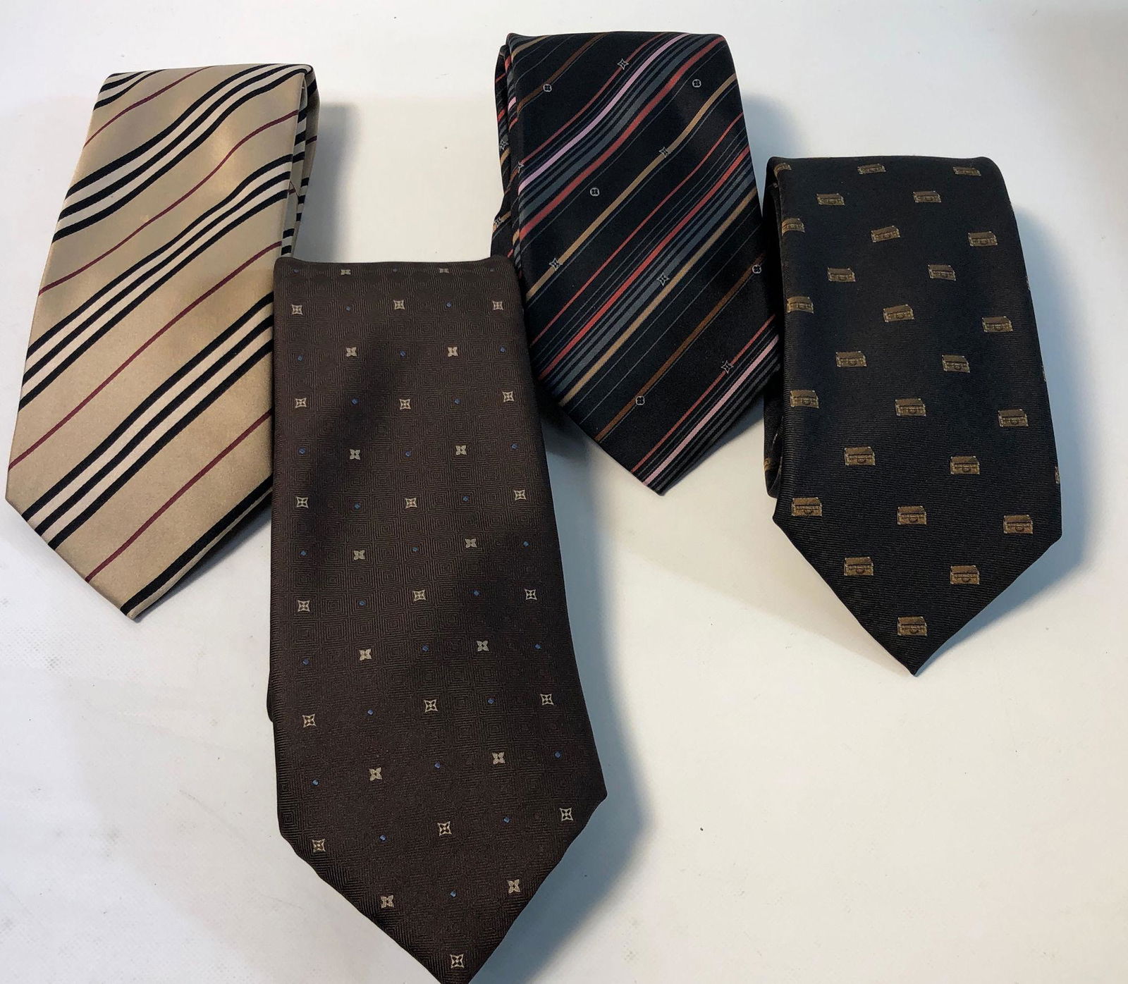 LOUIS VUITTON AND BURBERRY TIES: LOUIS VUITTON AND BURBERRY TIES ~ FOUR IN TOTAL, ONE BURBERRY TIE, 100% PURE SETA SOLE SILK, ITALIAN MADE FEATURING CLASSIC BURBERRY PATTERN, GENTLY USED WITH MINOR BLEMISHES, LABEL IS FRAYING, LOUIS