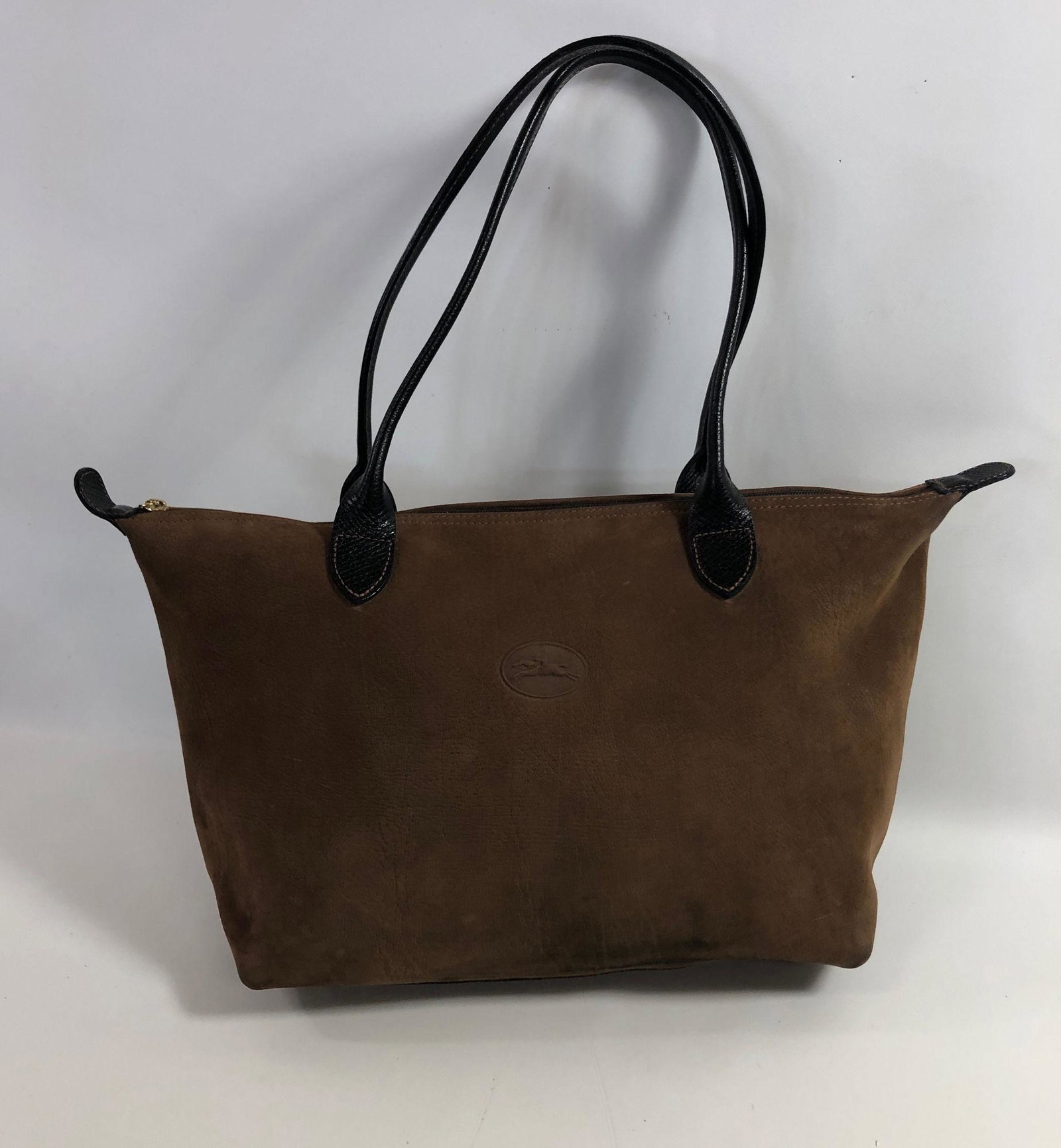 LONGCHAMP SUEDE HANDBAG: LONGCHAMP SUEDE HANDBAG ~ TOTE STYLE WITH ZIPPER CLOSURE, INTERIOR CLEAN, EXTERIOR CLEAN WITH MINOR DISCOLORATION ON BOTTOM CORNERS AND BASE OF FRONT, CARAMEL BROWN SUEDE WITH BLACK LEATHER HANDLES, G