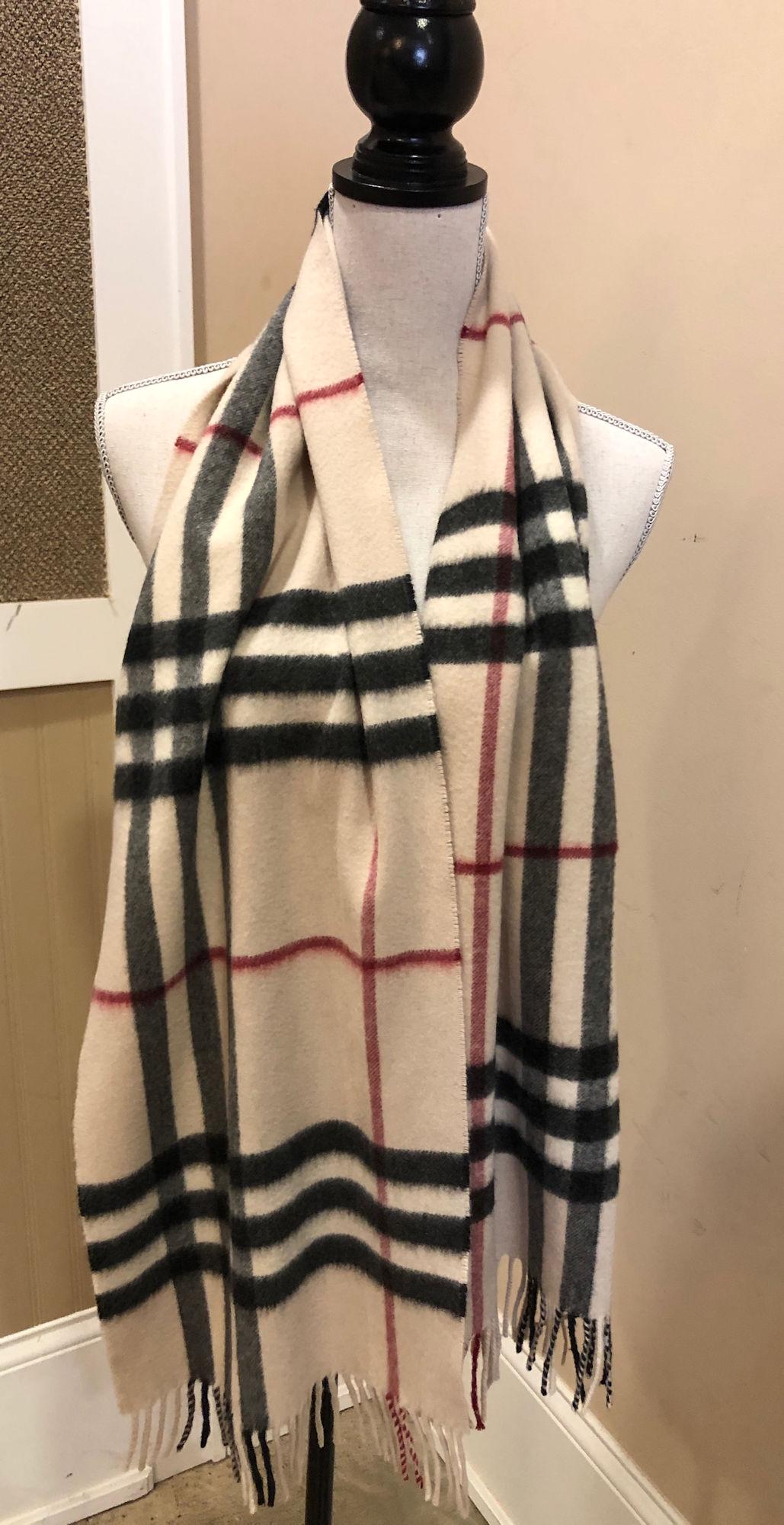 BURBERRY CASHMERE SCARF: BURBERRY CASHMERE SCARF ~ DESIGN FEATURES SIGNATURE PATTERN WITH CREAM BASE, TASSLED ENDS GENTLY USED, MADE EXCLUSIVELY IN SCOTLAND, APPROX. 70" X 12.5"