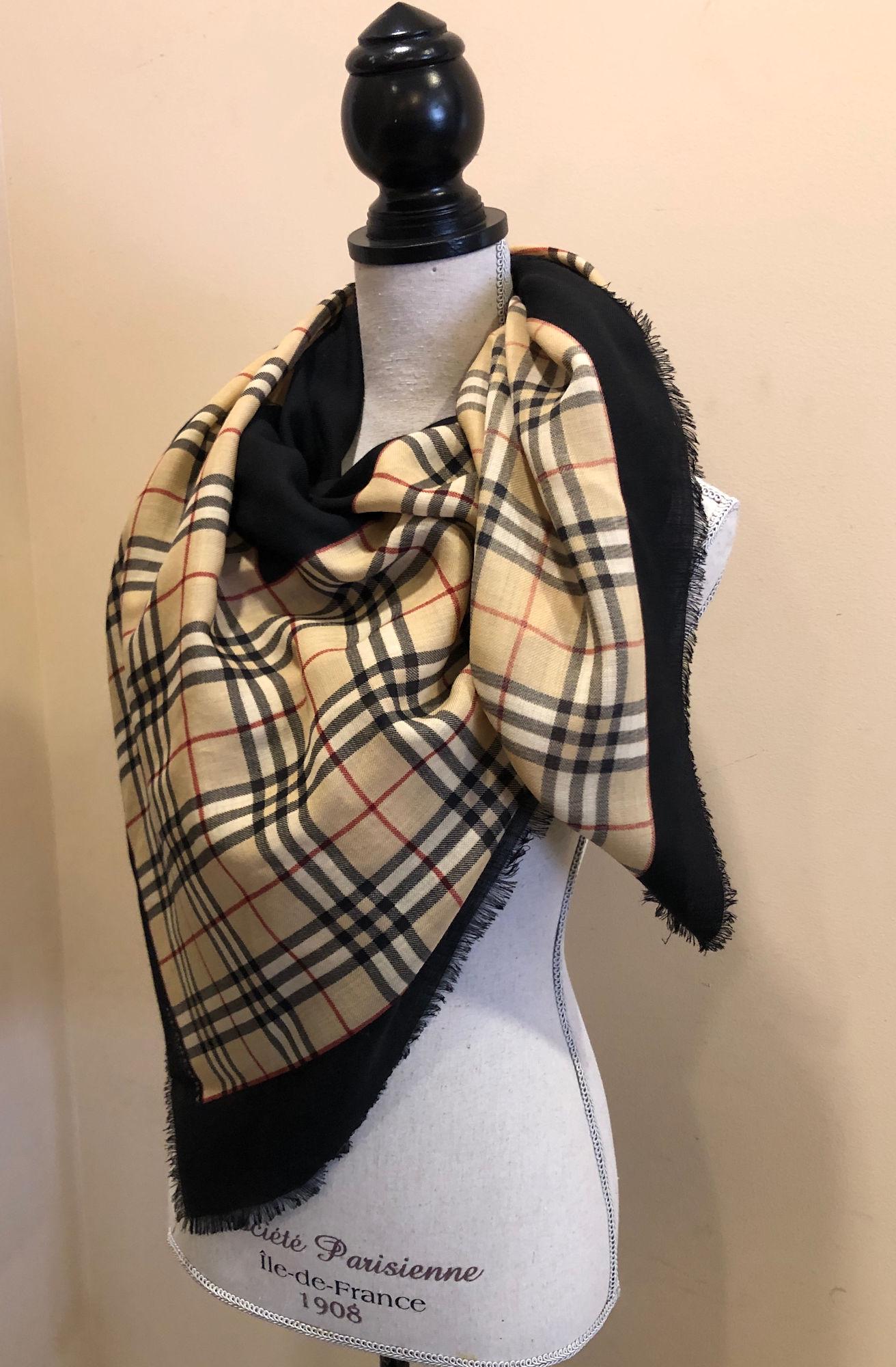 BURBERRY SCARF: BURBERRY SCARF ~ SQUARE WOOL SCARF FEATURING SIGNATURE PATTERN TRIMMED WITH BLACK, FRAYED EDGES, HOLE NEAR CENTER OF SCARF, APPROX. 54" X 54"
