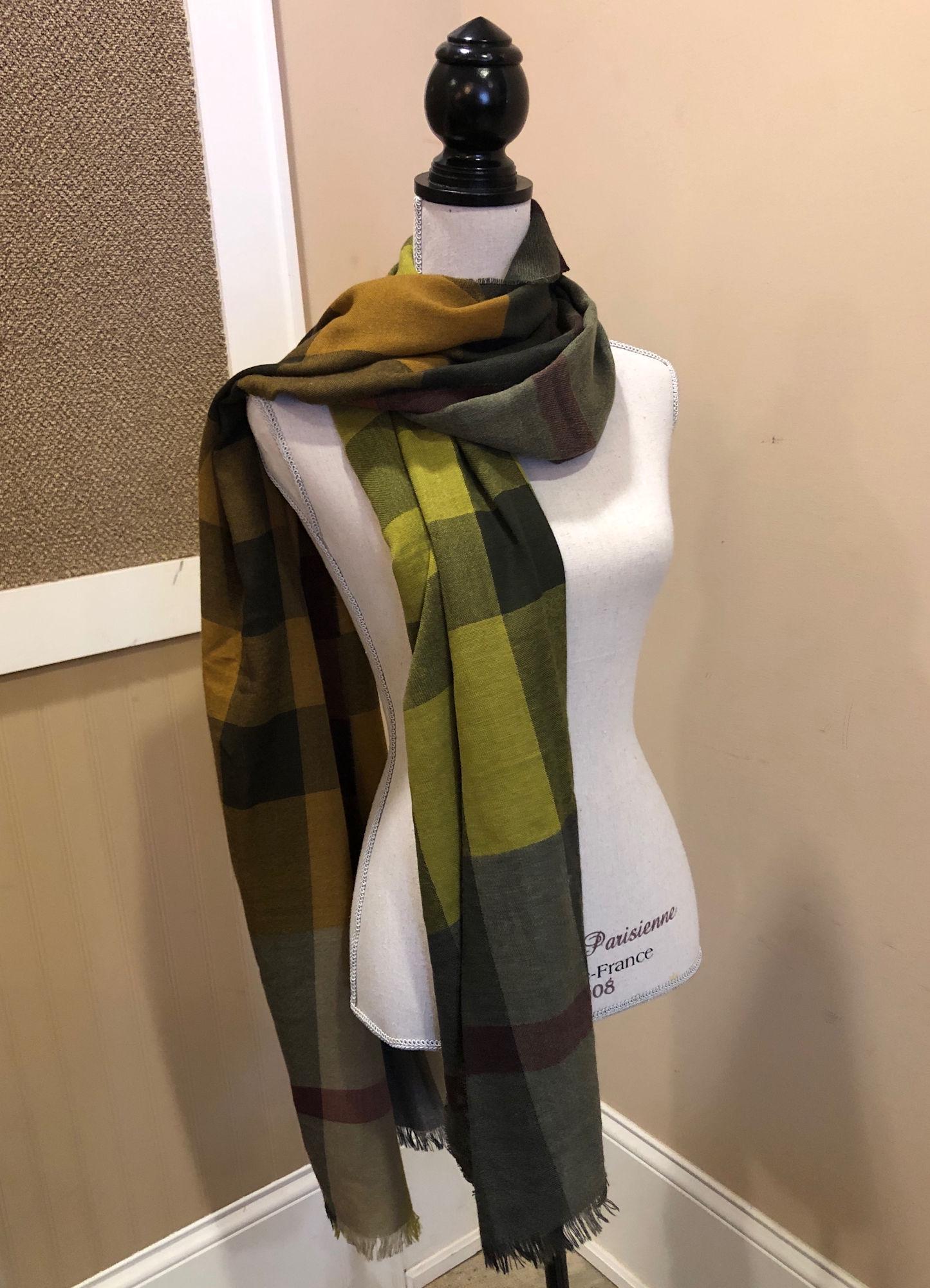 BURBERRY SCARF: BURBERRY SCARF ~ CLASSIC PATTERN IN ABSTRACT COLORS, EGGPLANT, MUSTARD YELLOW, SHADES OF GREEN AND MAROON, TASSLED ENDS, APPROX. 28" X 92" STYLE NO. NBGB4
