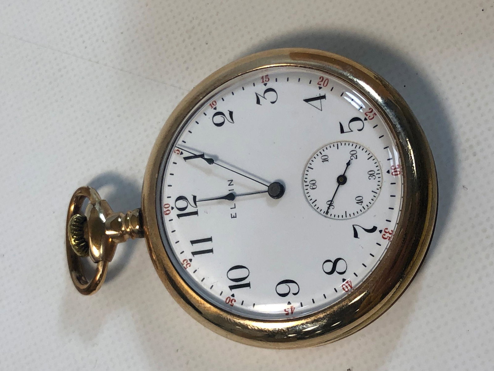 VINTAGE ELGIN POCKET WATCH: VINTAGE ELGIN POCKET WATCH ~ WINDS/SETS/TICKS AT TIME OF LISTING. HIGH POLISH CASE (1.875" GUARANTEED). STEM SET. 15-JEWEL MOVEMENT NUMBERED 14938824. WHITE FACE W/BLACK NUMERIC INDICATORS.