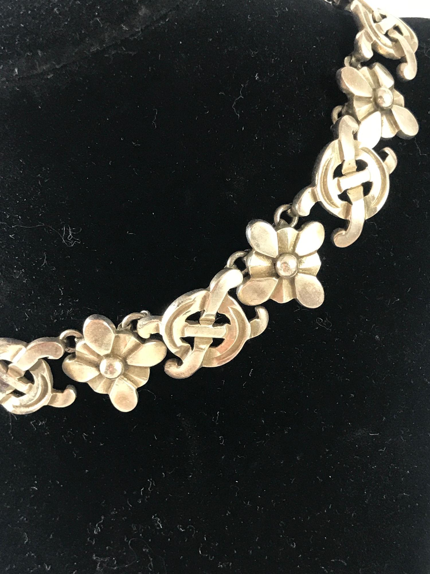 STERLING SILVER NECKLACE: STERLING SILVER NECKLACE ~ GORGEOUS 16" CHOKER LENGTH MEXICO MADE STERLING SILVER NECKLACEW/DIMENSIONAL CRISS-CROSS AND FLORAL DESIGNED LINKS. BOX CLASP CLOSURE. STAMPED AND TESTED. HIGH POLISH FINISH