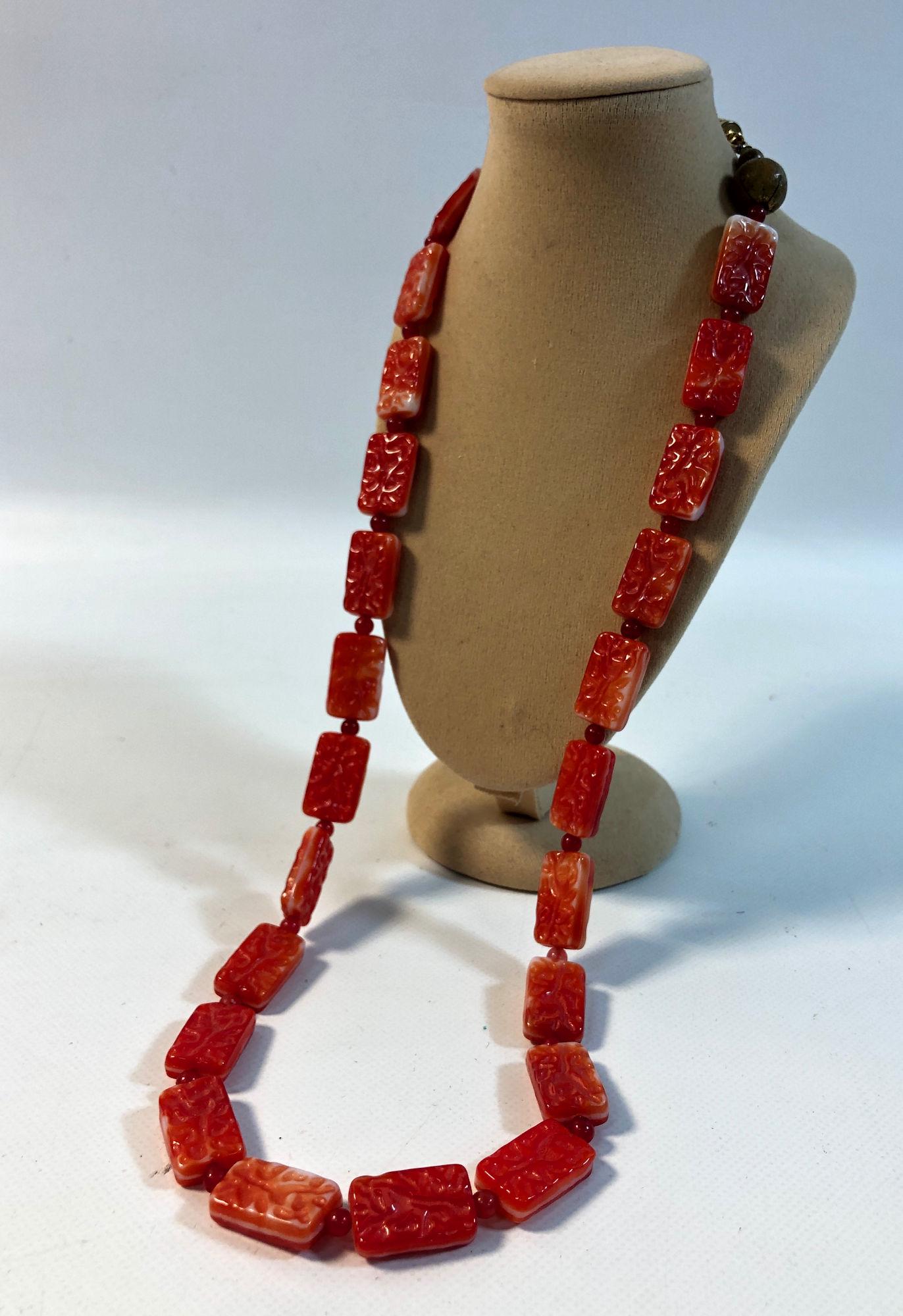VINTAGE GLASS NECKLACE: VINTAGE GLASS NECKLACE ~ RED/WHITE PRESSED GLASS BEADS W/RED CARNELIAN ACCENT STONES (SMALL). 23" MATINEE LENGTH W/SCREW CLASP CLOSURE. UNSIGNED PIECE.