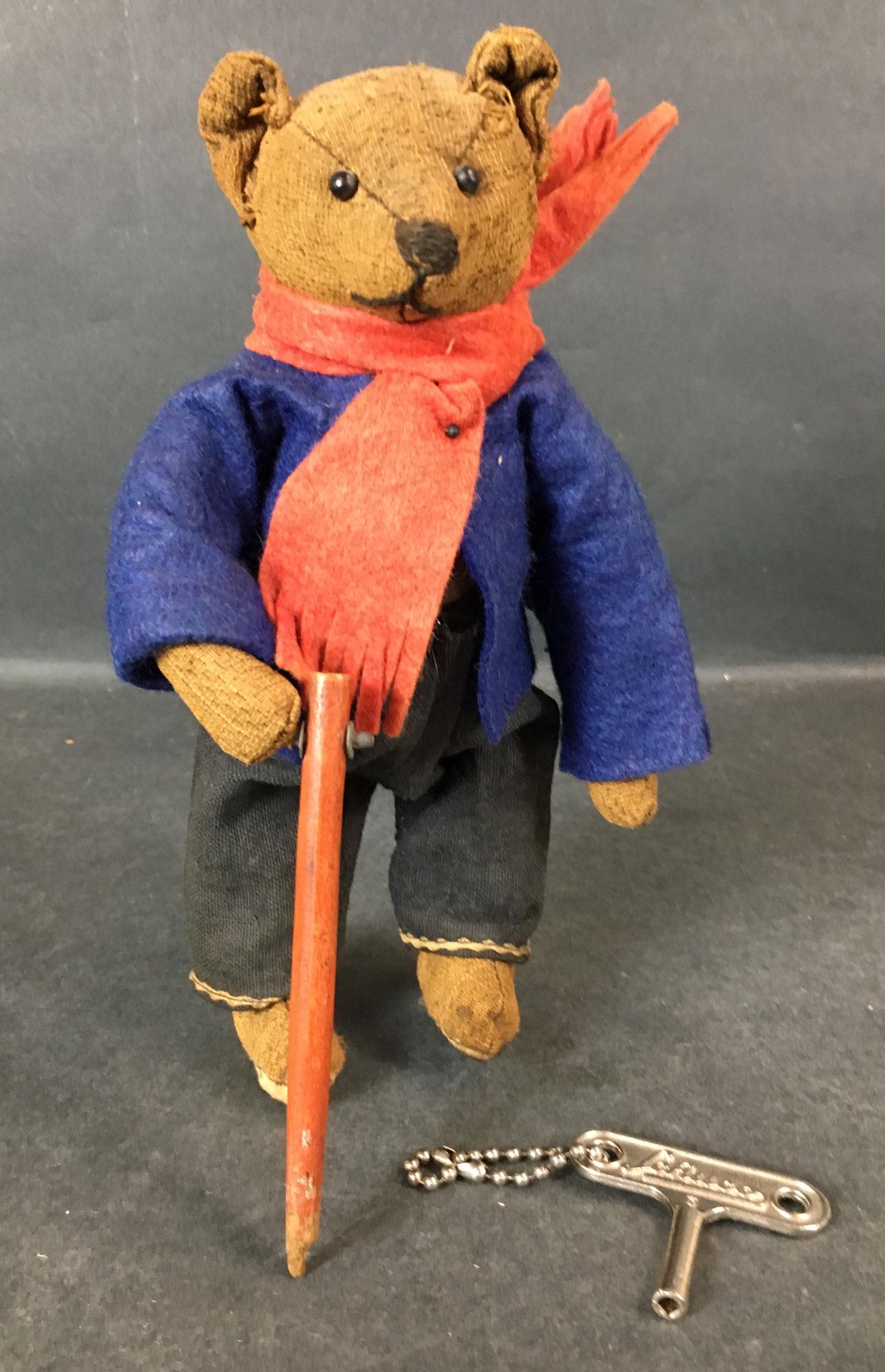 EARLY SCHUCO WALKING BEAR. 8" DRESSED BEAR WITH: EARLY SCHUCO WALKING BEAR. 8" DRESSED BEAR WITH ATTACHED WALKING STICK. KEY WIND MECHANISM AT SIDE MAKES BEAR'S LEGS MOVE BACK AND FORTH. RETAINS KEY.