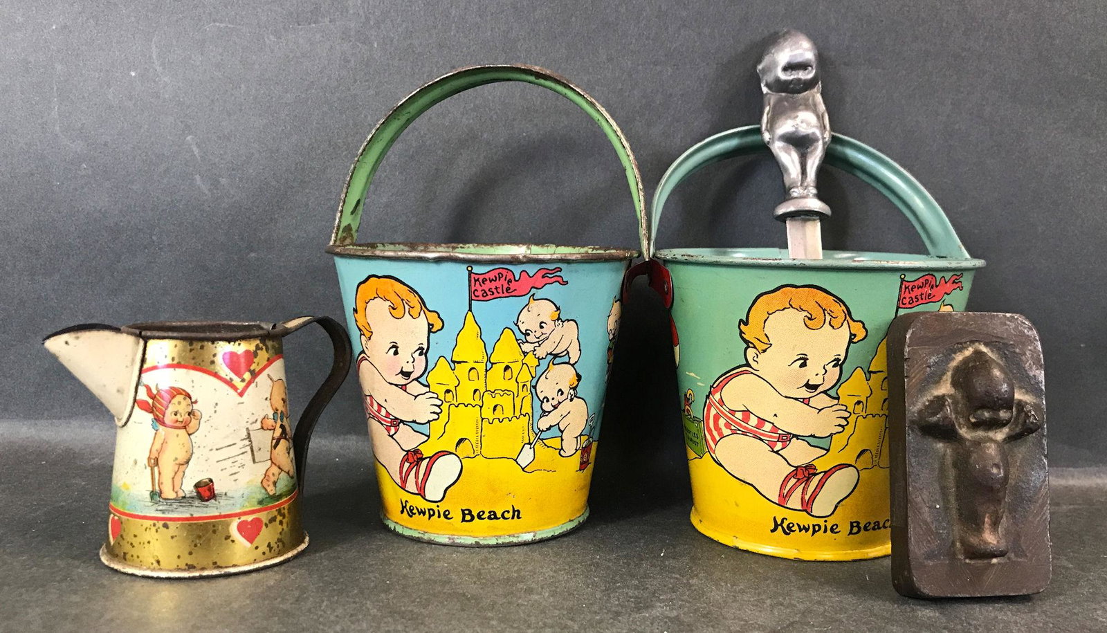 LOT VINTAGE KEWPIE ITEMS. INCLUDES 2 SMALL TIN BEACH (1 of 1)