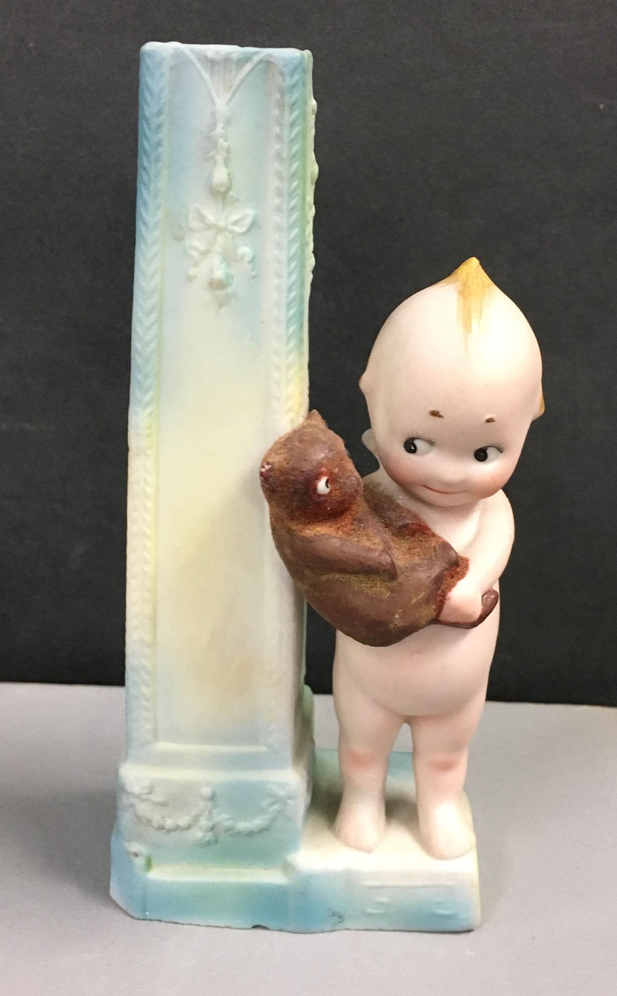 KEWPIE HOLDING FLOCKED BEAR ON BLUE AND IVORY VASE. 5 (1 of 5)
