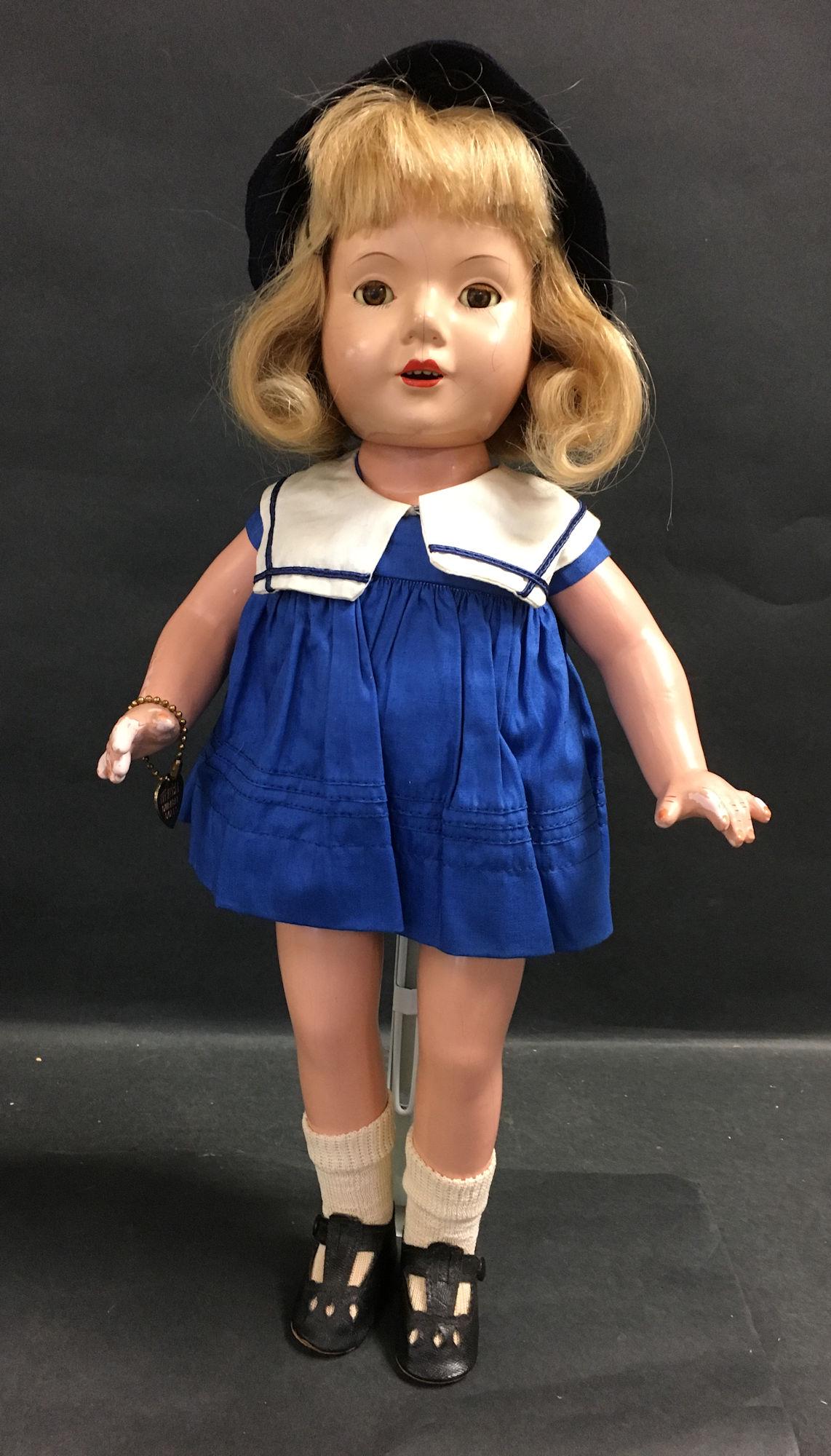 EFFANBEE COMPOSITION AMERICAN CHILD DESIGNED BY DEWEES: EFFANBEE COMPOSITION AMERICAN CHILD DESIGNED BY DEWEES COCHRAN. HUMAN HAIR WIG, SLEEP EYES, OPEN MOUTH WITH TEETH, ON FIVE PIECE COMPOSITION BODY. DOLL IS DRESSED IN ORIGINAL TAGGED SAILOR SUIT INCLUD