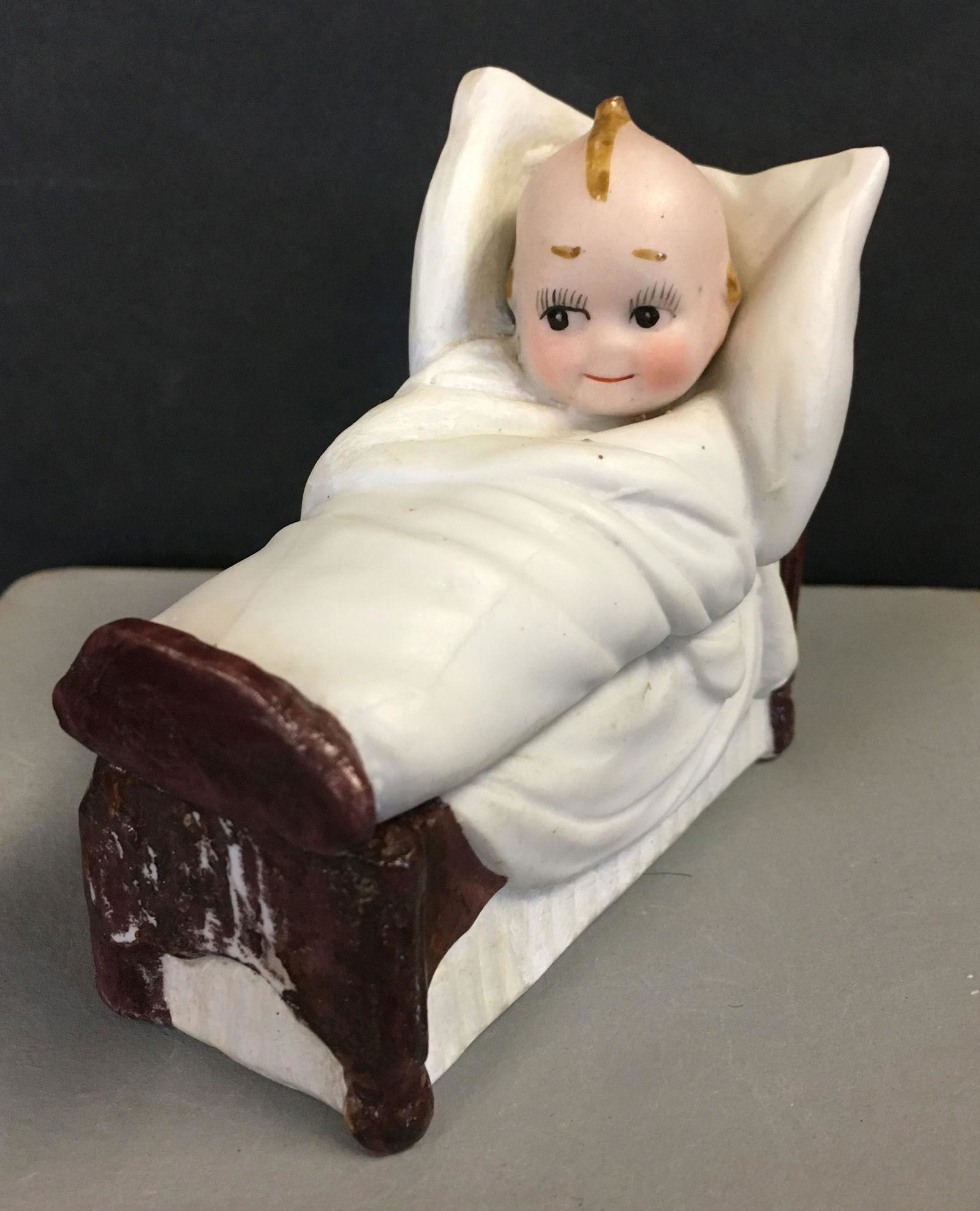 KEWPIE IN BED TRINKET BOX. 3" X 1 ¼" X 3" (1 of 4)