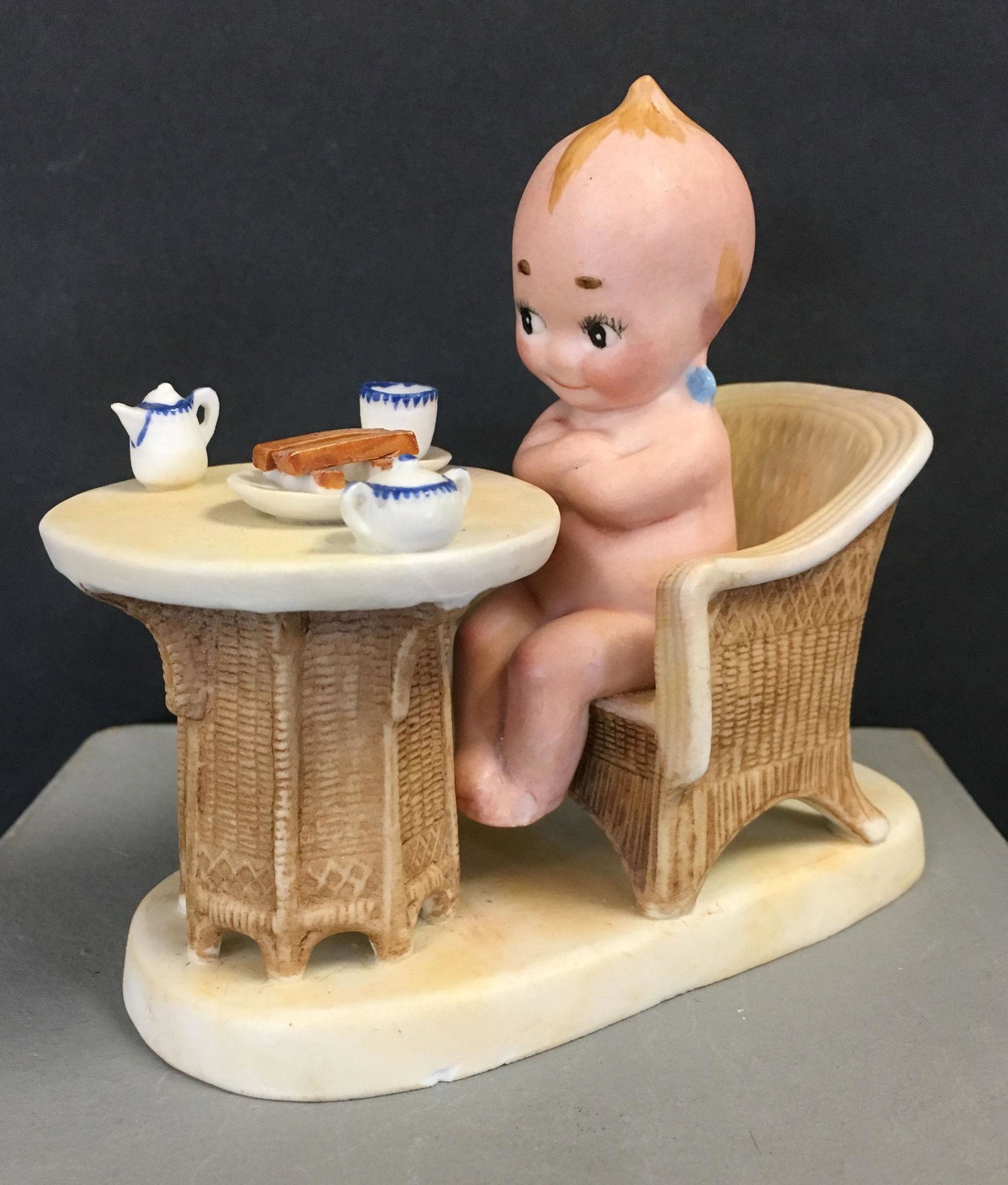 KEWPIE SITTING AT TABLE WITH TEA SET. 4" H X 4 ½ (1 of 6)