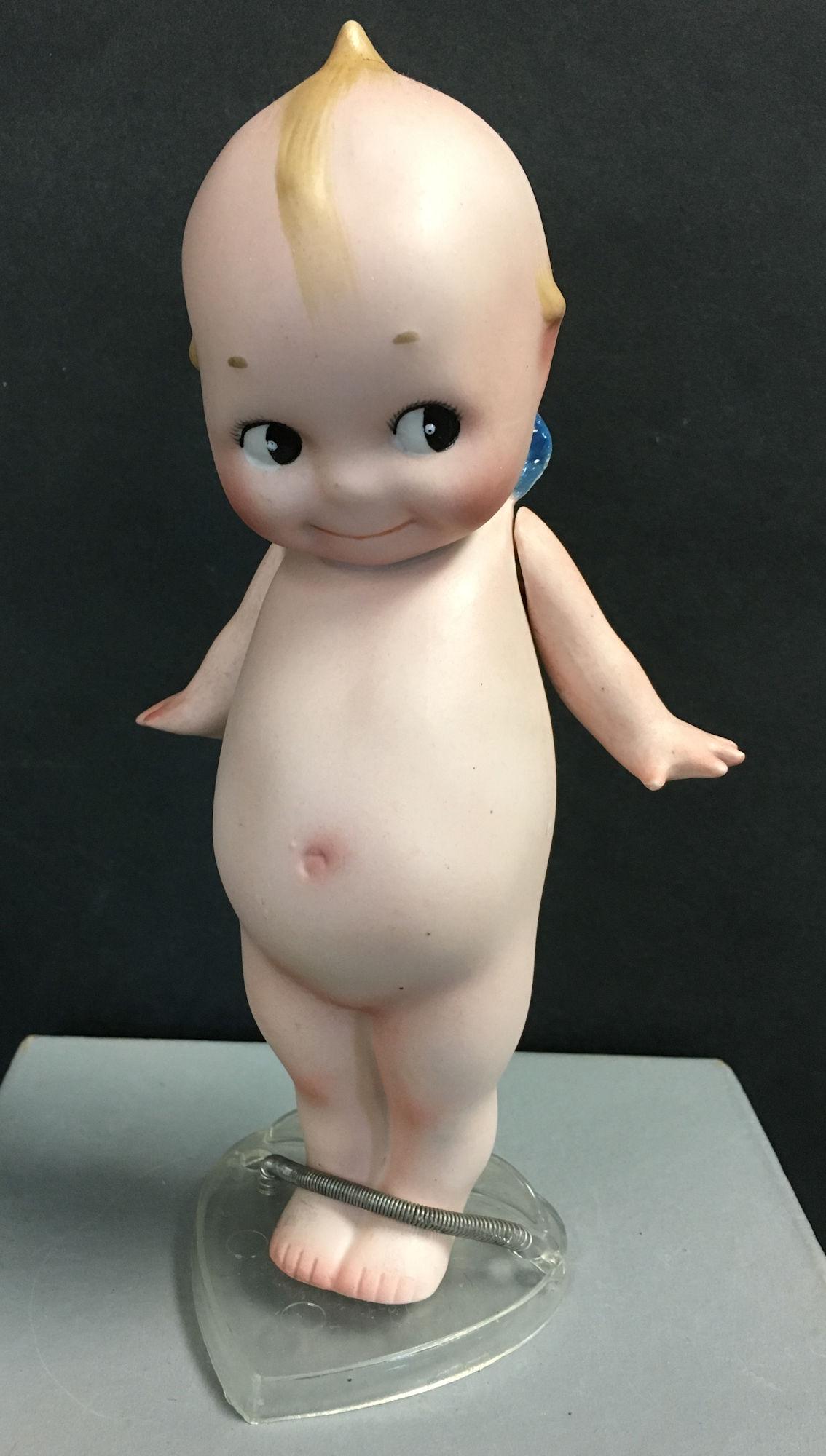 ALL BISQUE KEWPIE. ONE PIECE HEAD, TORSO AND LEGS, (1 of 4)