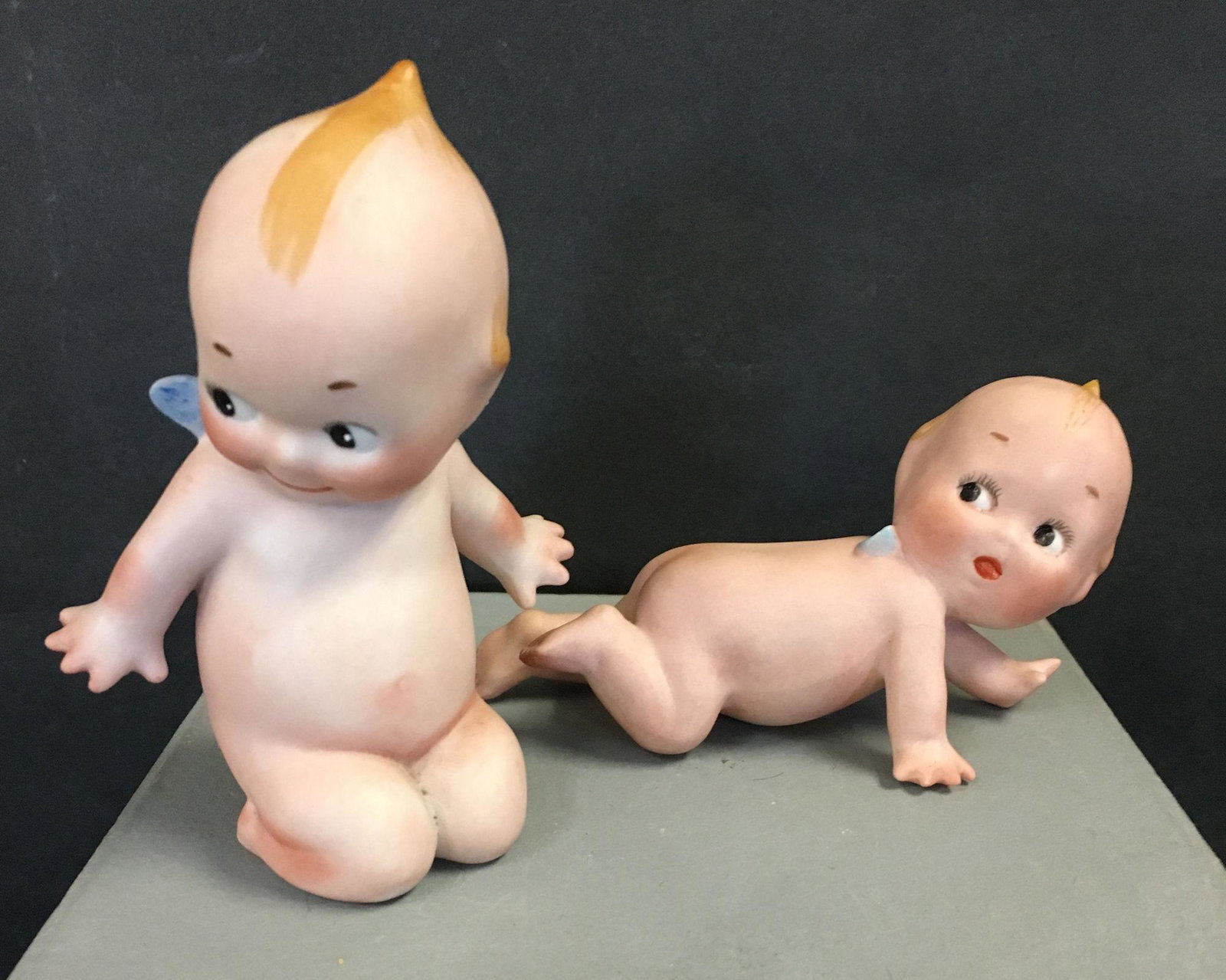 (2) BLUNDERBOO KEWPIES. CRAWLING KEWPIE 4" LONG,: (2) BLUNDERBOO KEWPIES. CRAWLING KEWPIE 4" LONG, INCISED "O'NEILL" ON BELLY. KNEELING KEWPIE 3 ¾" H, INCISED "O'NEILL" AND STAMPED © ON BOTTOM.