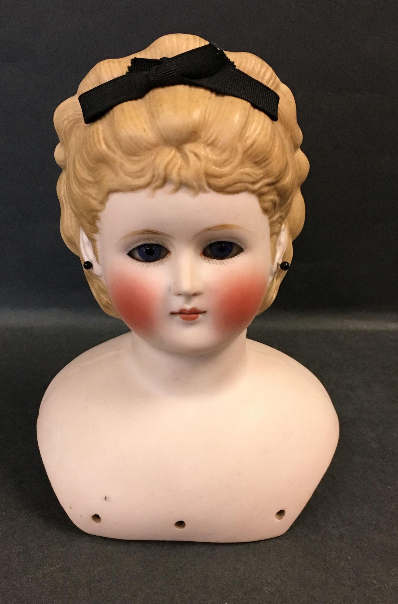 7" PARIAN SHOULDER HEAD ONLY. CAFÃ‰ AU LAIT HAIR WITH: 7" PARIAN SHOULDER HEAD ONLY. CAFÃ‰ AU LAIT HAIR WITH ATTACHED HAIR RIBBON, GLASS EYES, PIERCED EARS AND CLOSED MOUTH.