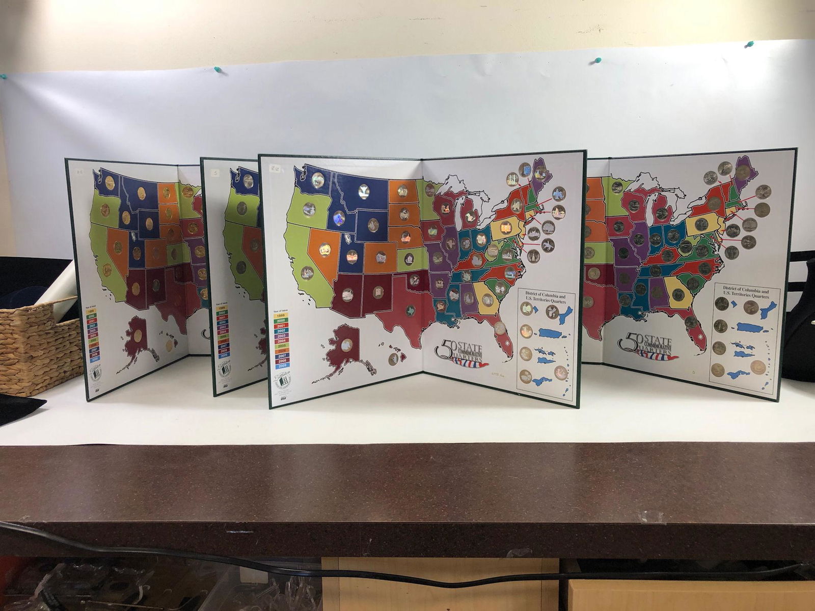 FOUR SETS OF U.S. STATE QUARTERS IN FOLIOS (1 of 5)