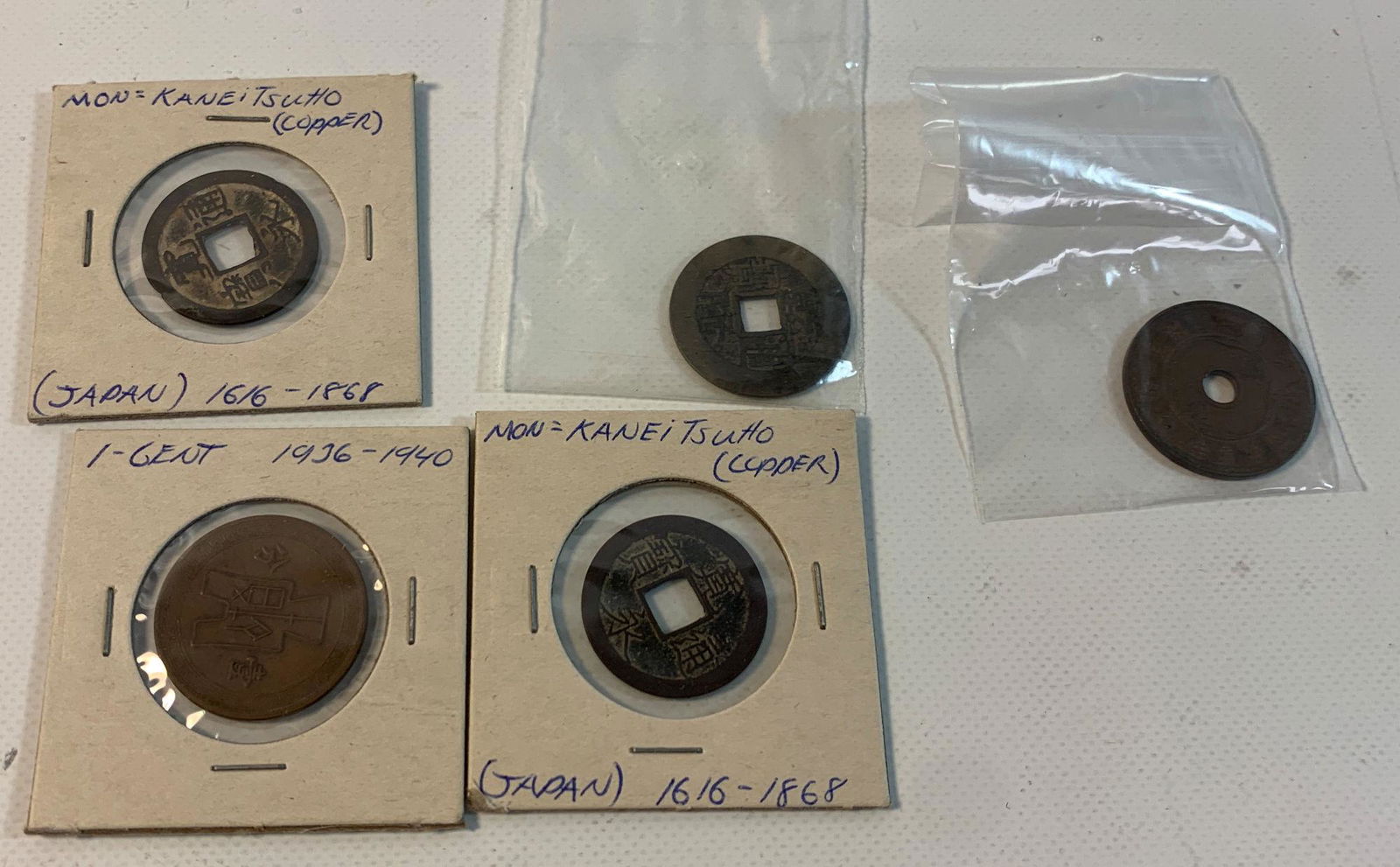 ANTIQUE TO VINTAGE ASIAN COINAGE: ANTIQUE TO VINTAGE ASIAN COINAGE ~ FIVE TOTAL. NOT GRADED. EXAMPLES MOSTLY ABOUT GOOD OR BETTER. CHINESE AND JAPANESE COINS/TOKENS. TWO COPPER JAPANESE COINS. 1-CENT CHINESE COIN DATED 1936-1940. TWO