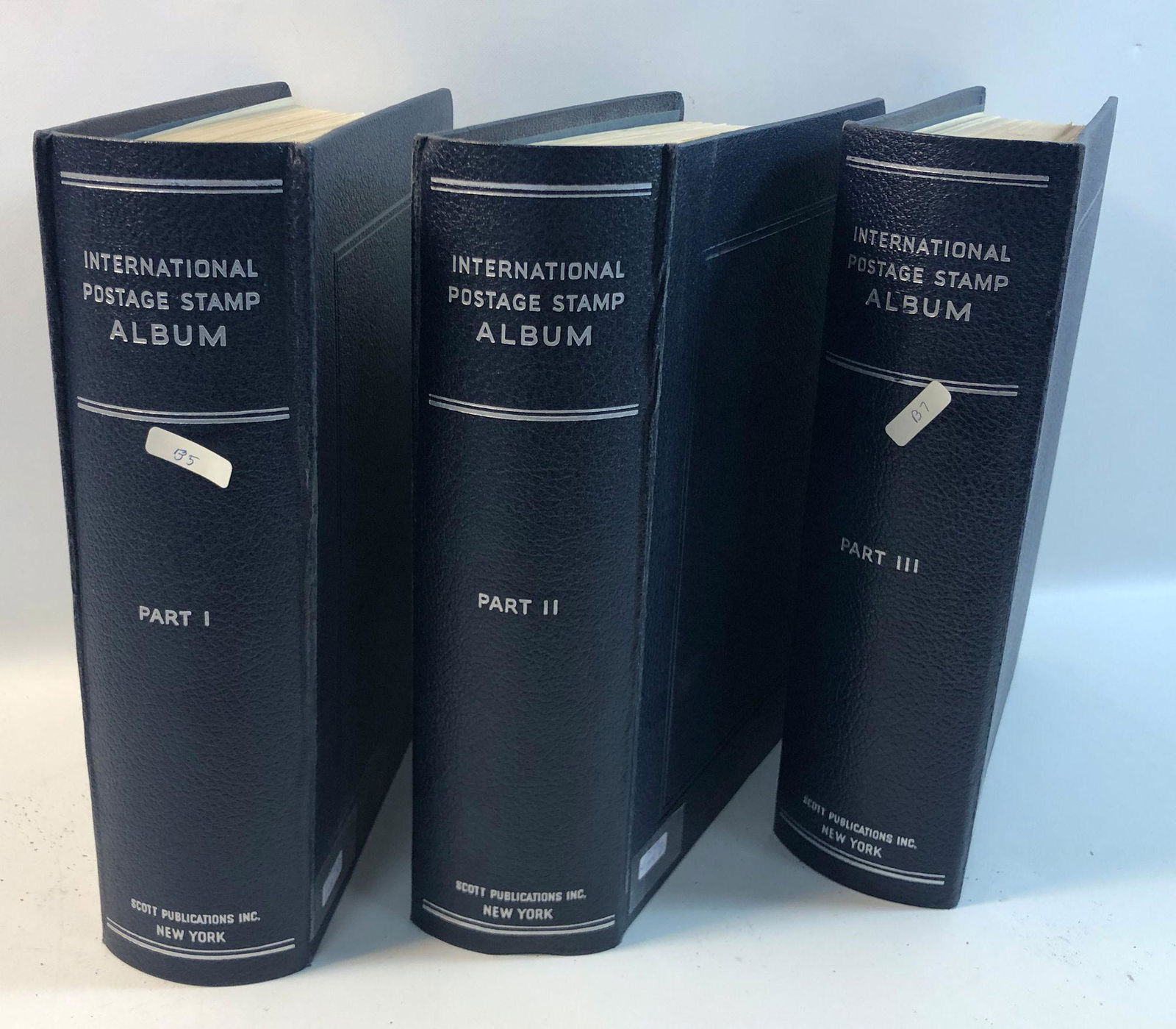 THREE INTERNATIONAL POSTAGE STAMP ALBUMS FROM SCOTT (1 of 15)