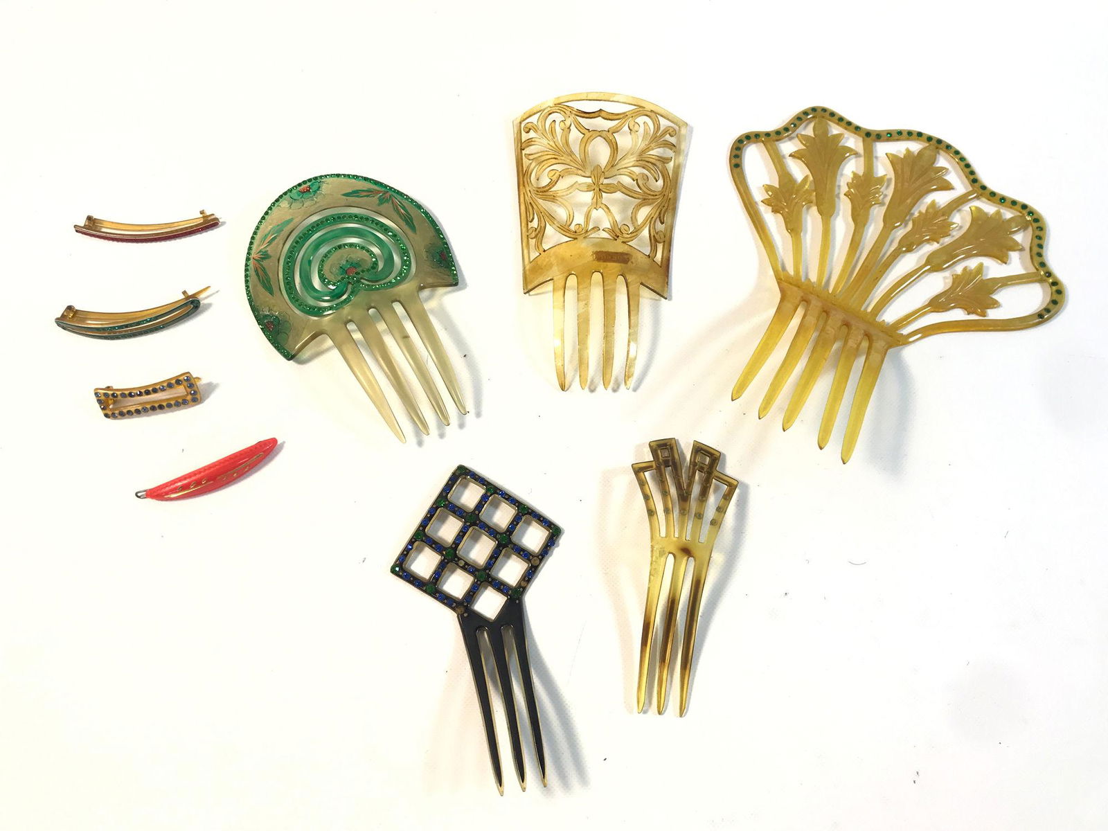 VINTAGE HAIR COMBS AND CLIPS: VINTAGE HAIR COMBS AND CLIPS ~ LOT INCLUDES 8" OPENWORK YELLOW HAIR COMB W/ GREEN RHINESTONE ACCENTS AND FLORAL DESIGN, 5.25" HAIR COMB W/ BLACK BACKGROUND AND OPENWORK DIAMOND PATTERN W/ GREEN AND BL