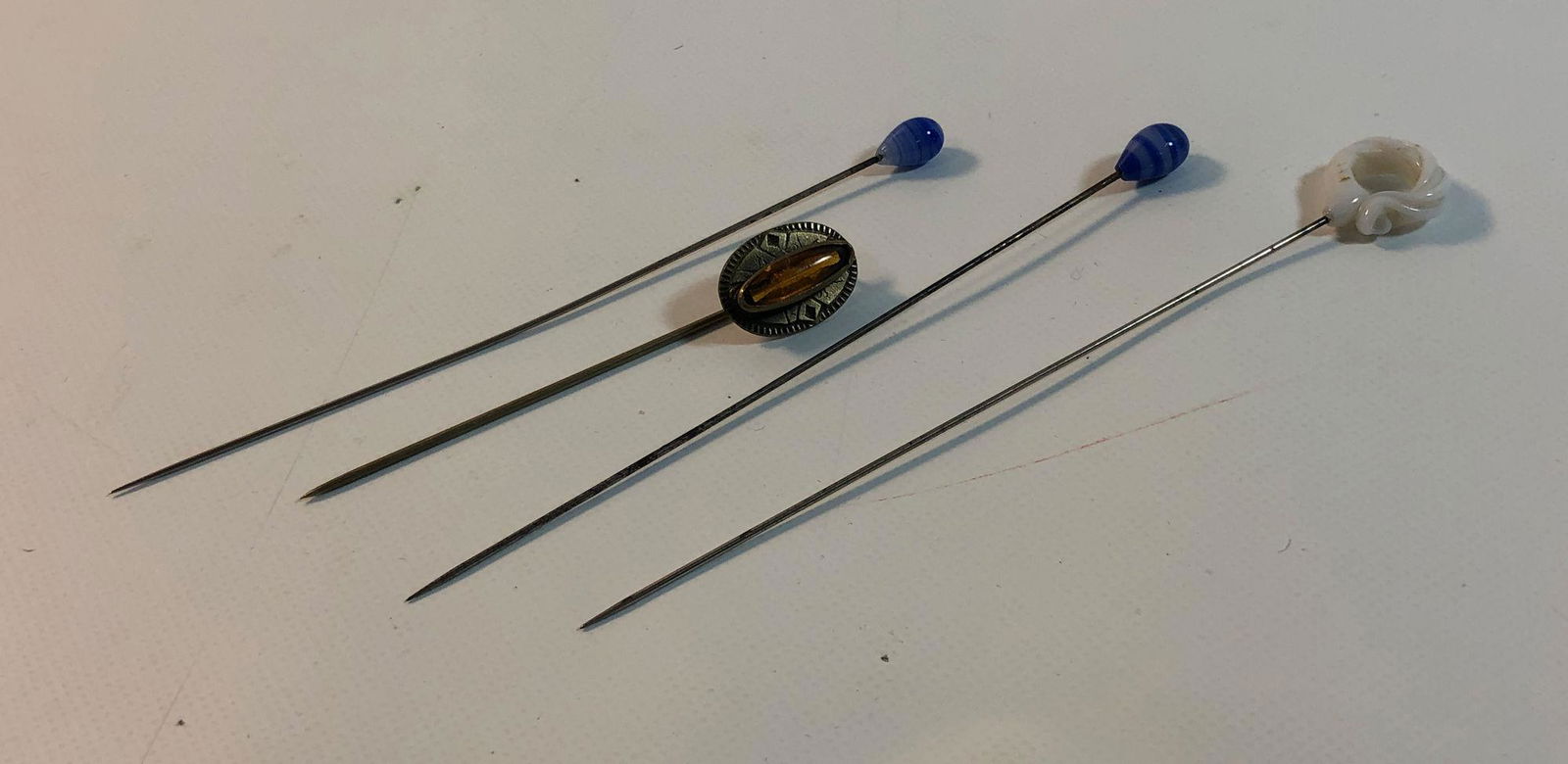 FOUR VINTAGE STICK PINS (1 of 4)