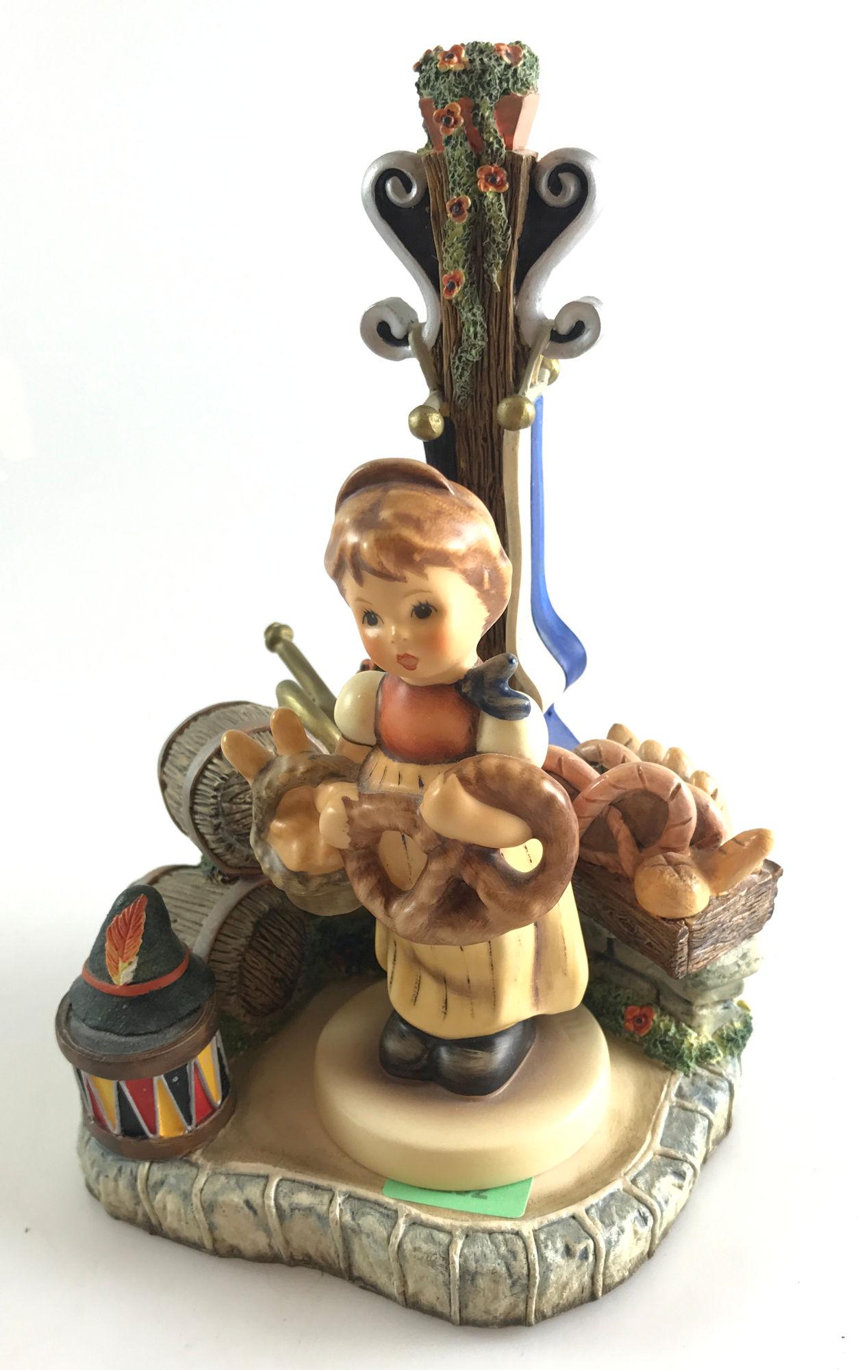 HUMMEL FIGURINE "OKTOBERFEST" 7" TALL, WITH GOEBEL: HUMMEL FIGURINE "OKTOBERFEST" 7" TALL, WITH GOEBEL "PRETZEL GIRL"