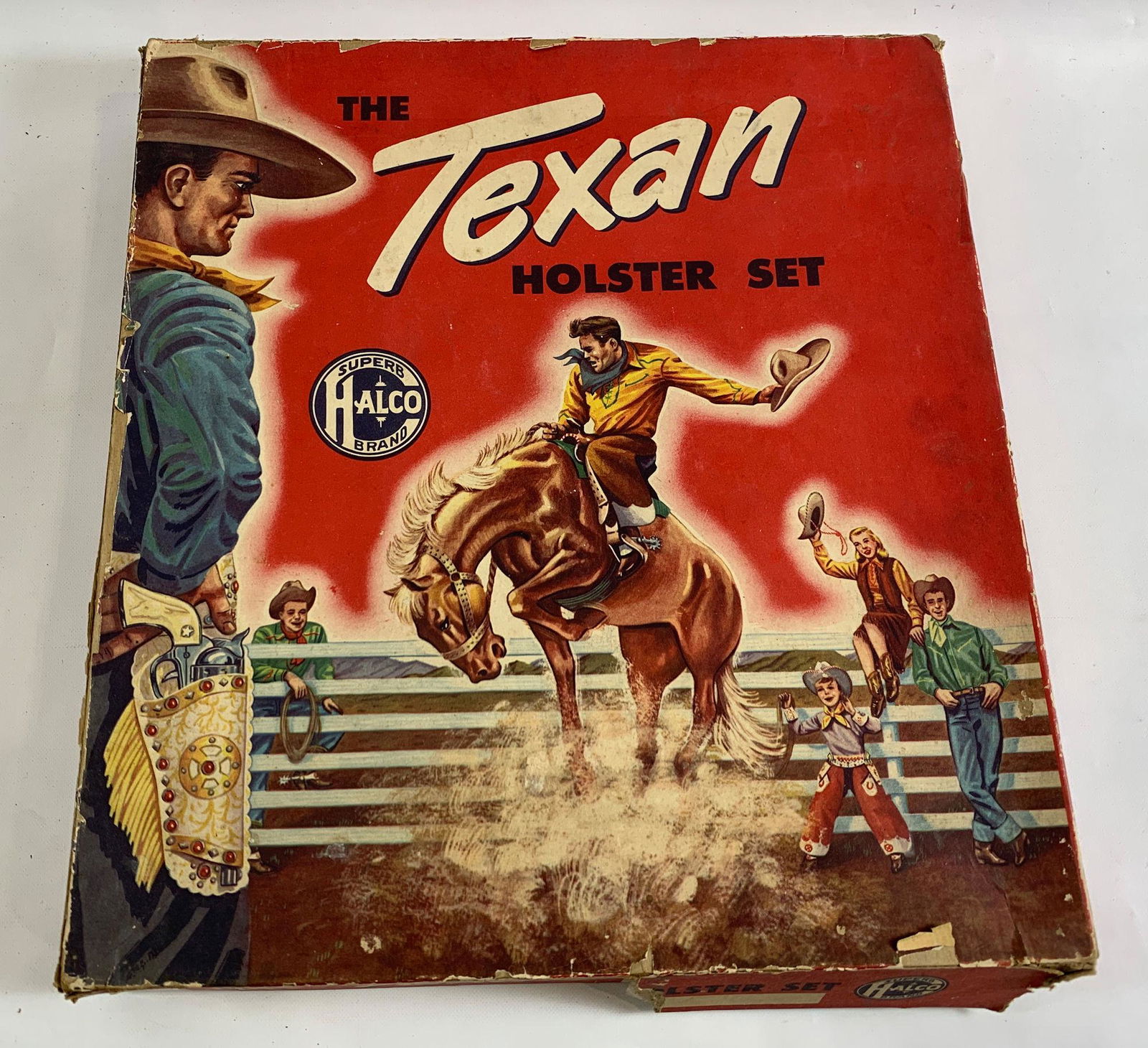 HALCO BRAND "THE TEXAN HOLSTER SET" IN ORIGINAL BOX,: HALCO BRAND "THE TEXAN HOLSTER SET" IN ORIGINAL BOX, TAN AND BROWN LEATHER DOUBLE HOLSTERS WITH BELT, BULLETS, AND TURQUOISE JEWELS WITH PAIR OF HUBLEY "TEXAN" CAP GUNS, NICKEL FINISH AND ENGRAVED WHI