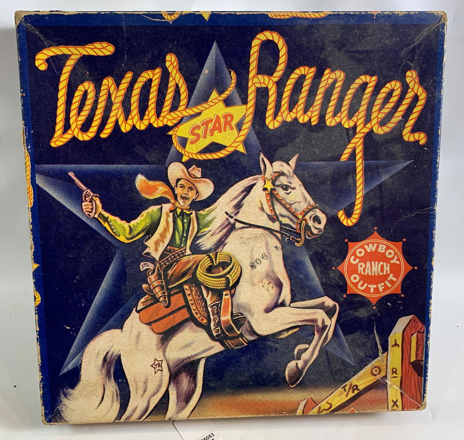 TEXAS RANGER COWBOY RANCH OUTFIT IN ORIGINAL BOX: TEXAS RANGER COWBOY RANCH OUTFIT IN ORIGINAL BOX INCLUDING BLACK LEATHER HOLSTER SET WITH BULLETS, TEXAS RANGER CAP GUNS AND BADGE.