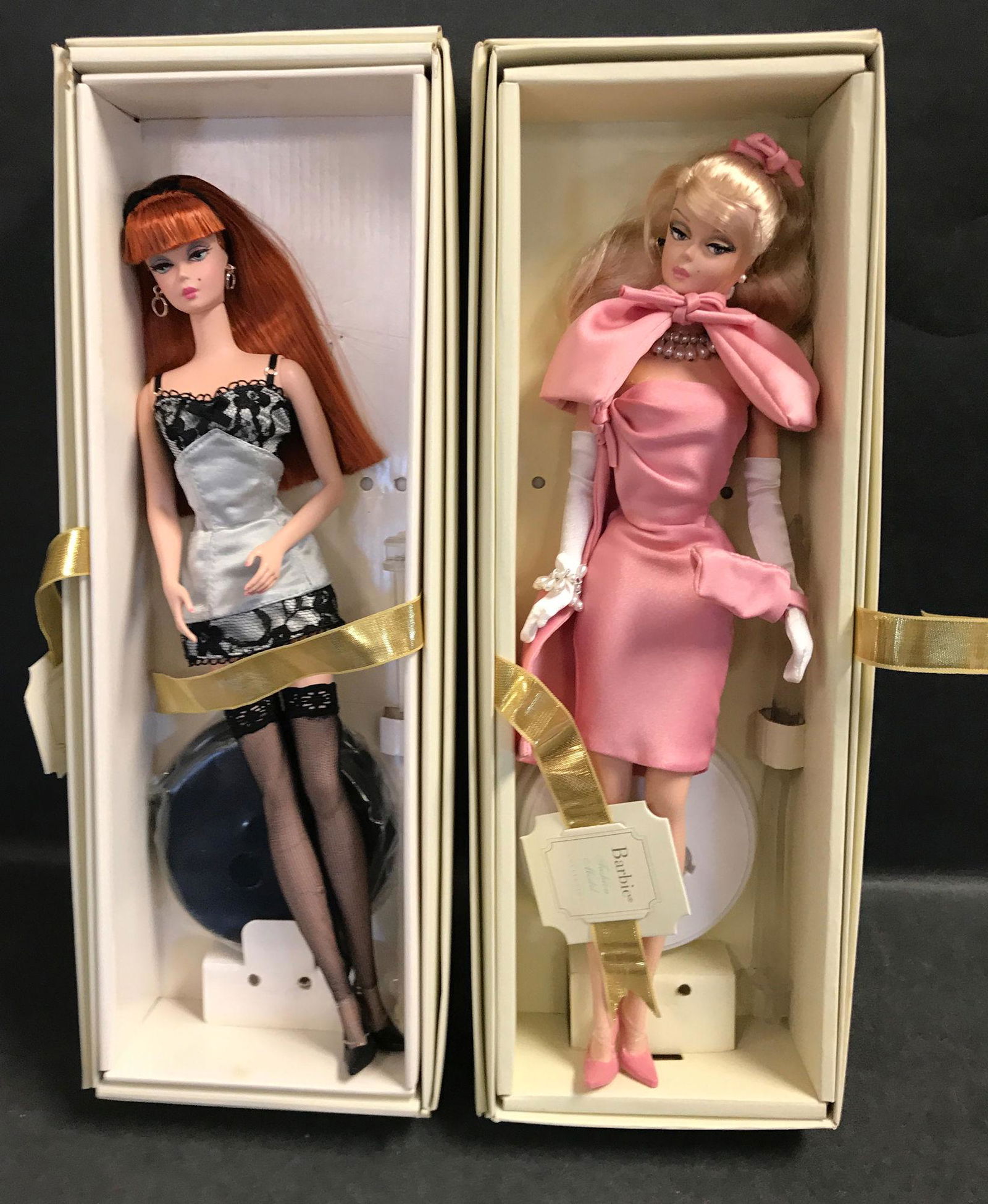 (2) SILKSTONE BARBIES INCLUDING "LINGERIE" (REDHEAD): (2) SILKSTONE BARBIES INCLUDING "LINGERIE" (REDHEAD) AND "MOVIE MIXER". BOTH DOLLS HAVE BEEN REMOVED FROM THEIR BOXES AND DISPLAYED. BOXES AND DISPLAY STANDS ARE INCLUDED.