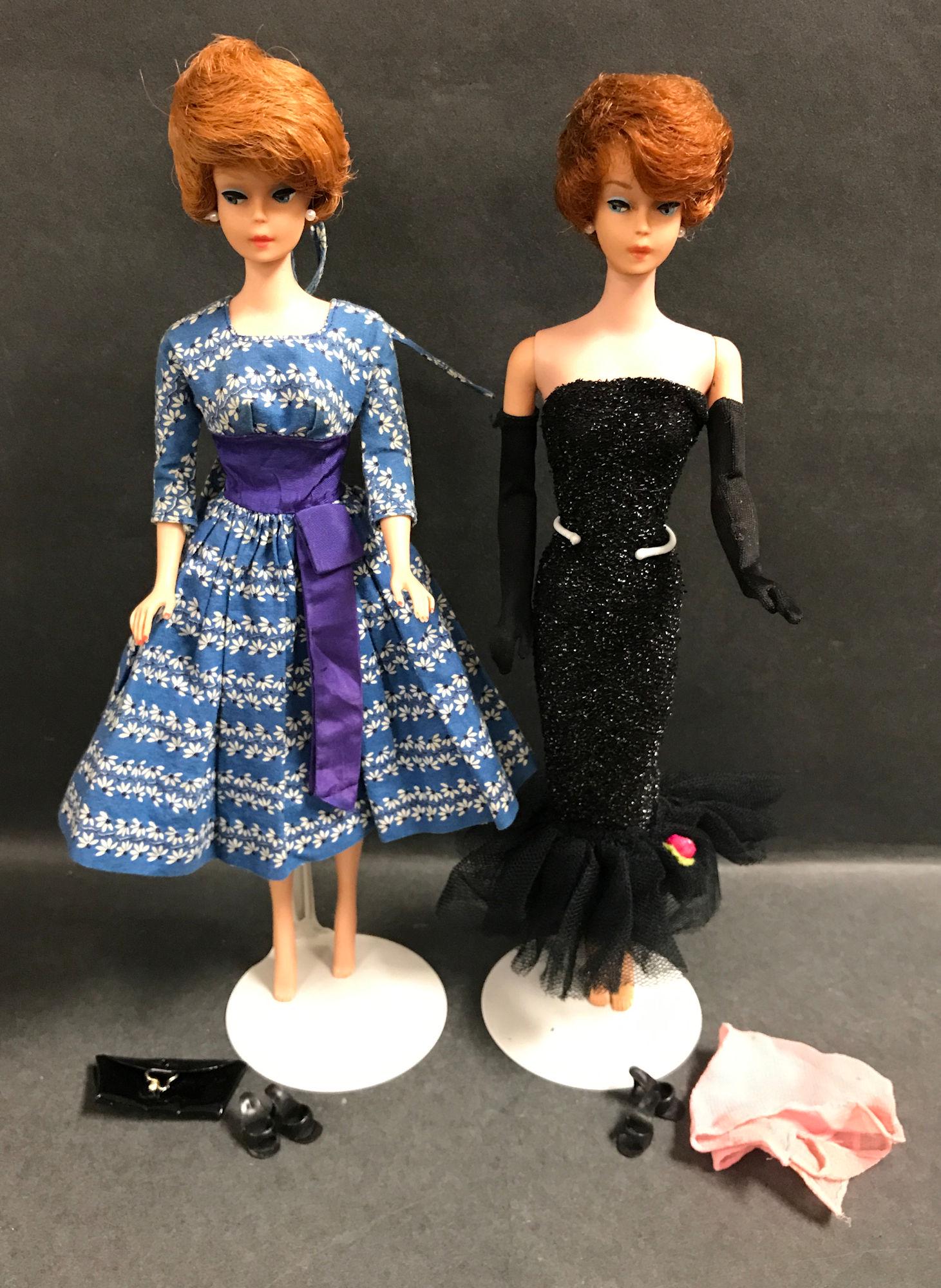 (2) TITIAN BUBBLECUT BARBIES DRESSED IN "SOLO IN THE: (2) TITIAN BUBBLECUT BARBIES DRESSED IN "SOLO IN THE SPOTLIGHT" #982 (MISSING MICROPHONE AND NECKLACE) AND "LET'S DANCE" #978 (MISSING NECKLACE) WITH BLACK CLUTCH.