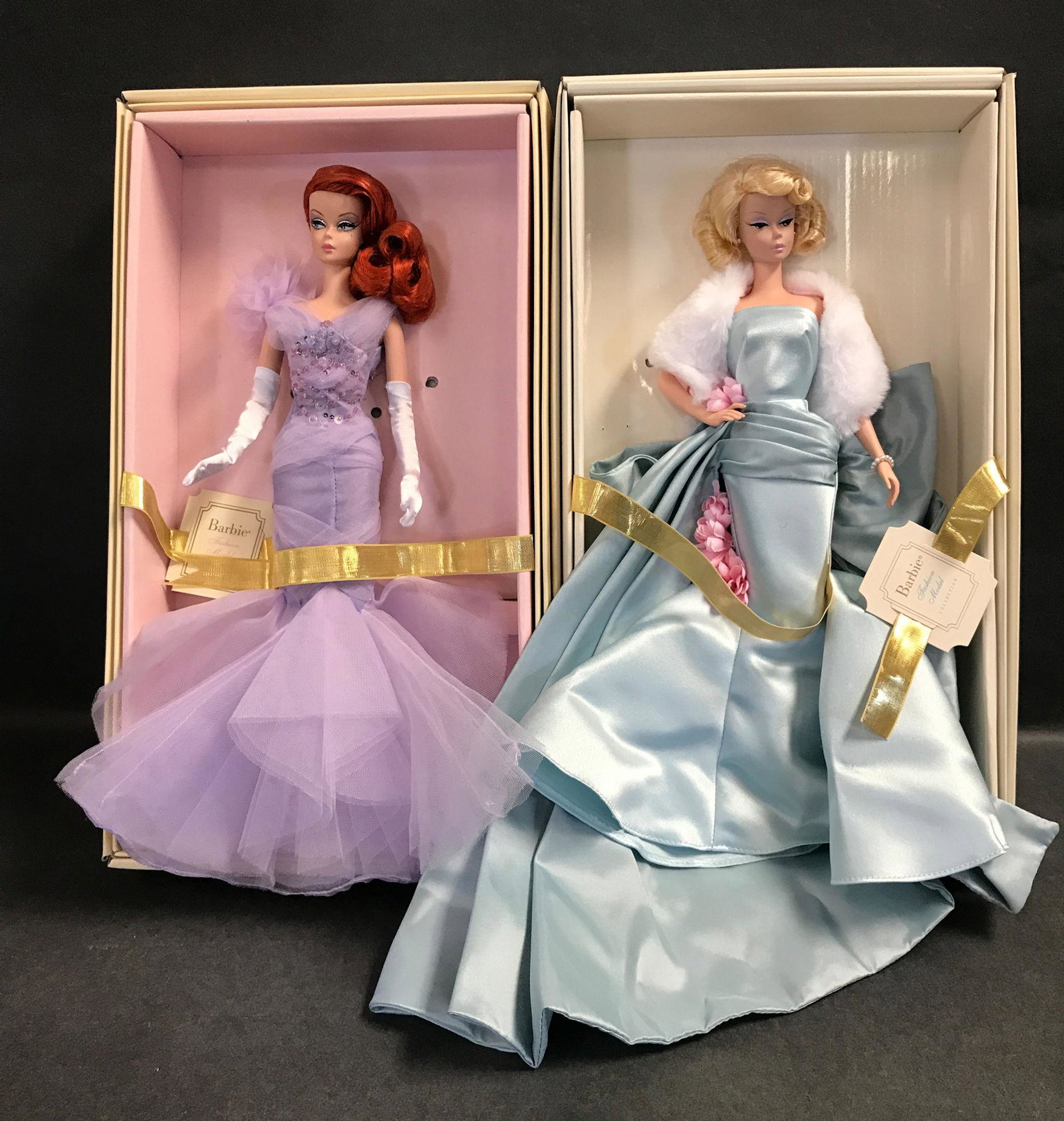 (2) SILKSTONE BARBIES INCLUDING "LAVENDER LUXE" AND: (2) SILKSTONE BARBIES INCLUDING "LAVENDER LUXE" AND "DELPHINE". BOTH HAVE BEEN REMOVED FROM THEIR BOXES AND DISPLAYED. BOXES ARE INCLUDED.