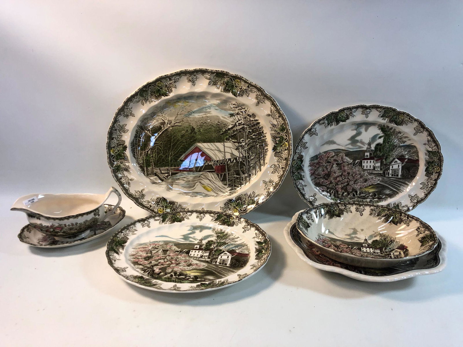 7 PCS. JOHNSON BROS. "FRIENDLY VILLAGE" CHINA INCL. 3: 7 PCS. JOHNSON BROS. "FRIENDLY VILLAGE" CHINA INCL. 3 PLATTERS, 3 SERVING DISHES, AND A GRAVY TUREEN.