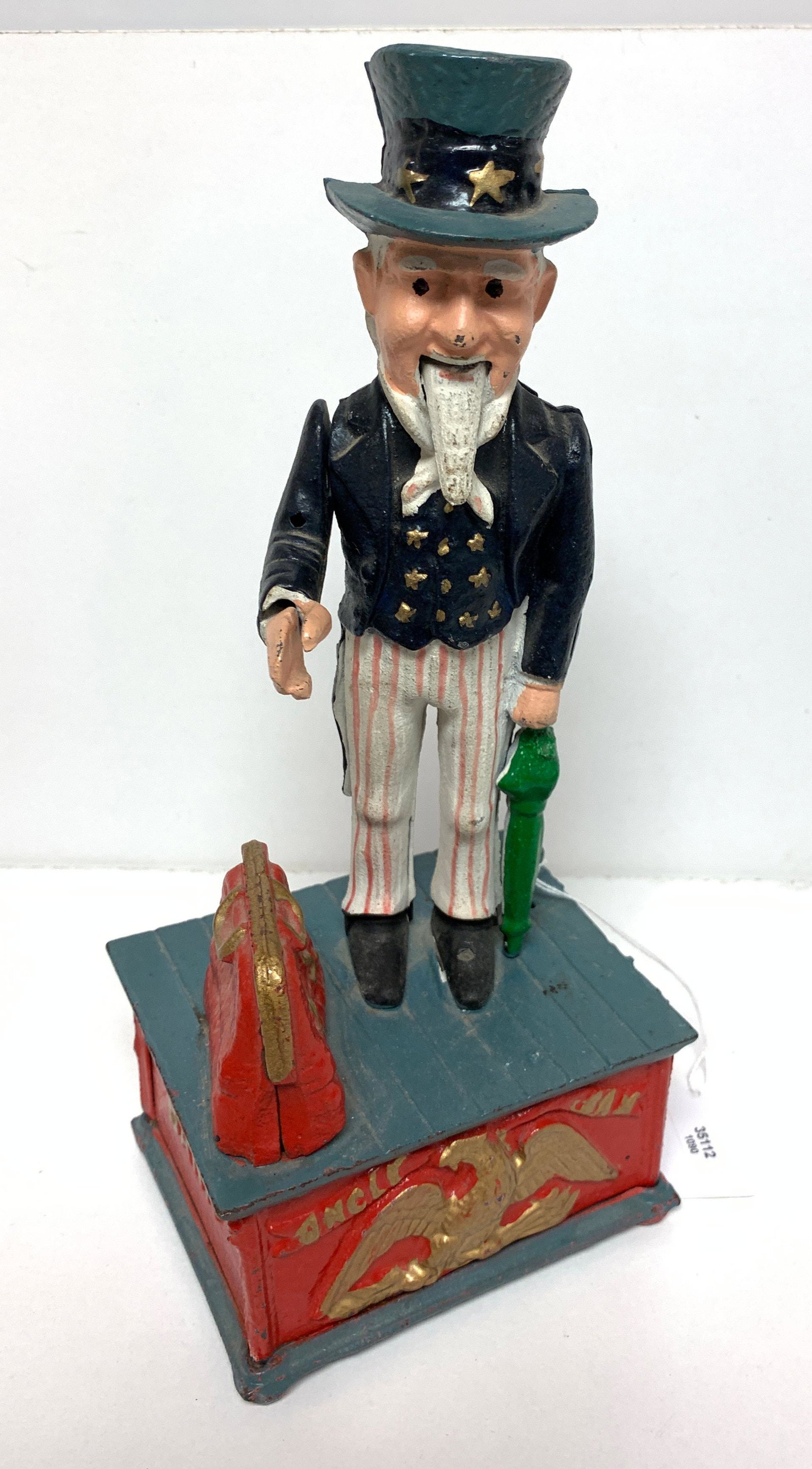 REPRODUCTION CAST IRON UNCLE SAM MECHANICAL BANK,: REPRODUCTION CAST IRON UNCLE SAM MECHANICAL BANK, APPROX. 11.25" HEIGHT
