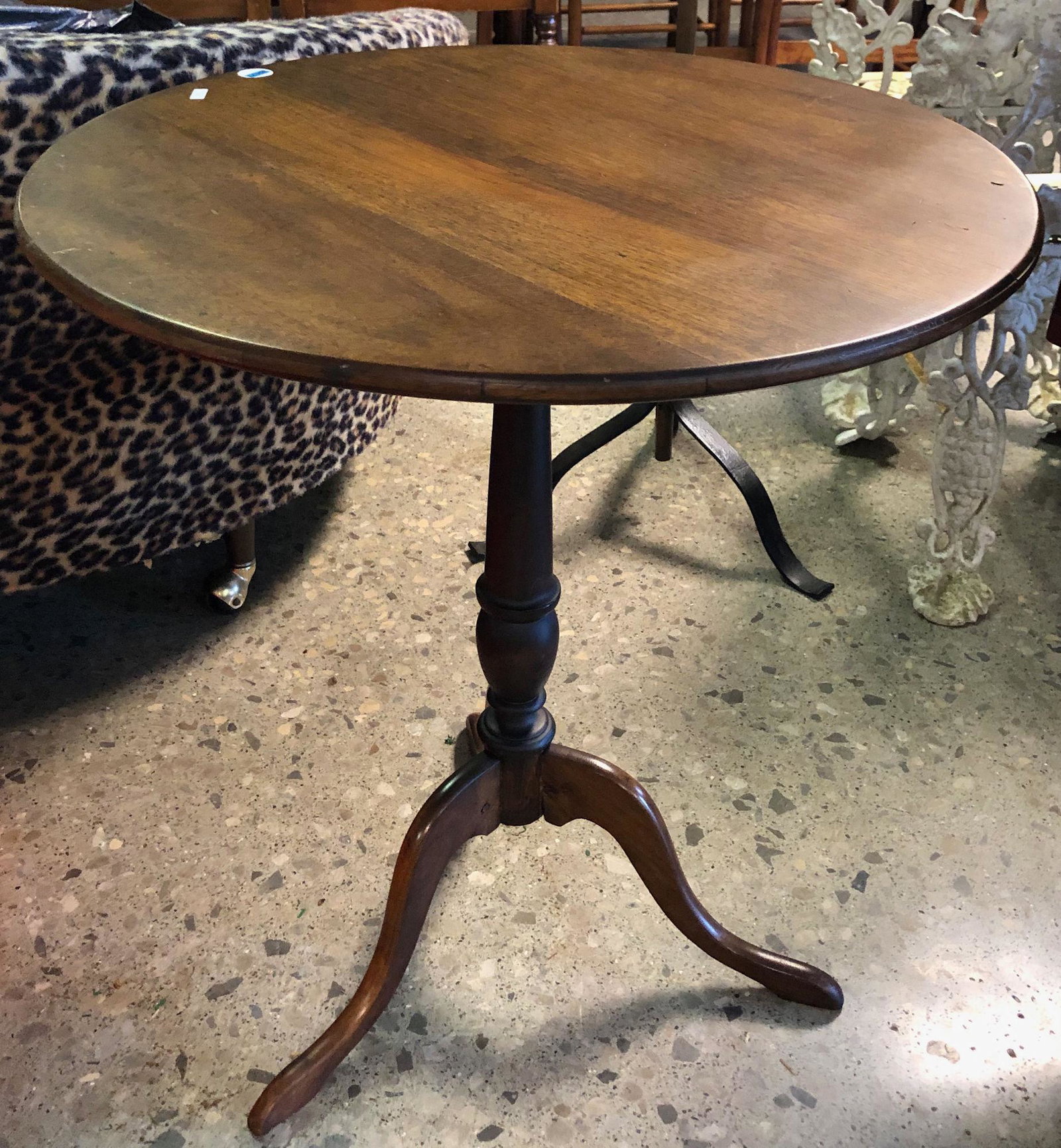 WALNUT TILT TOP SNAKE FOOT AND TRIPOD BASE TABLE. 24"D (1 of 2)