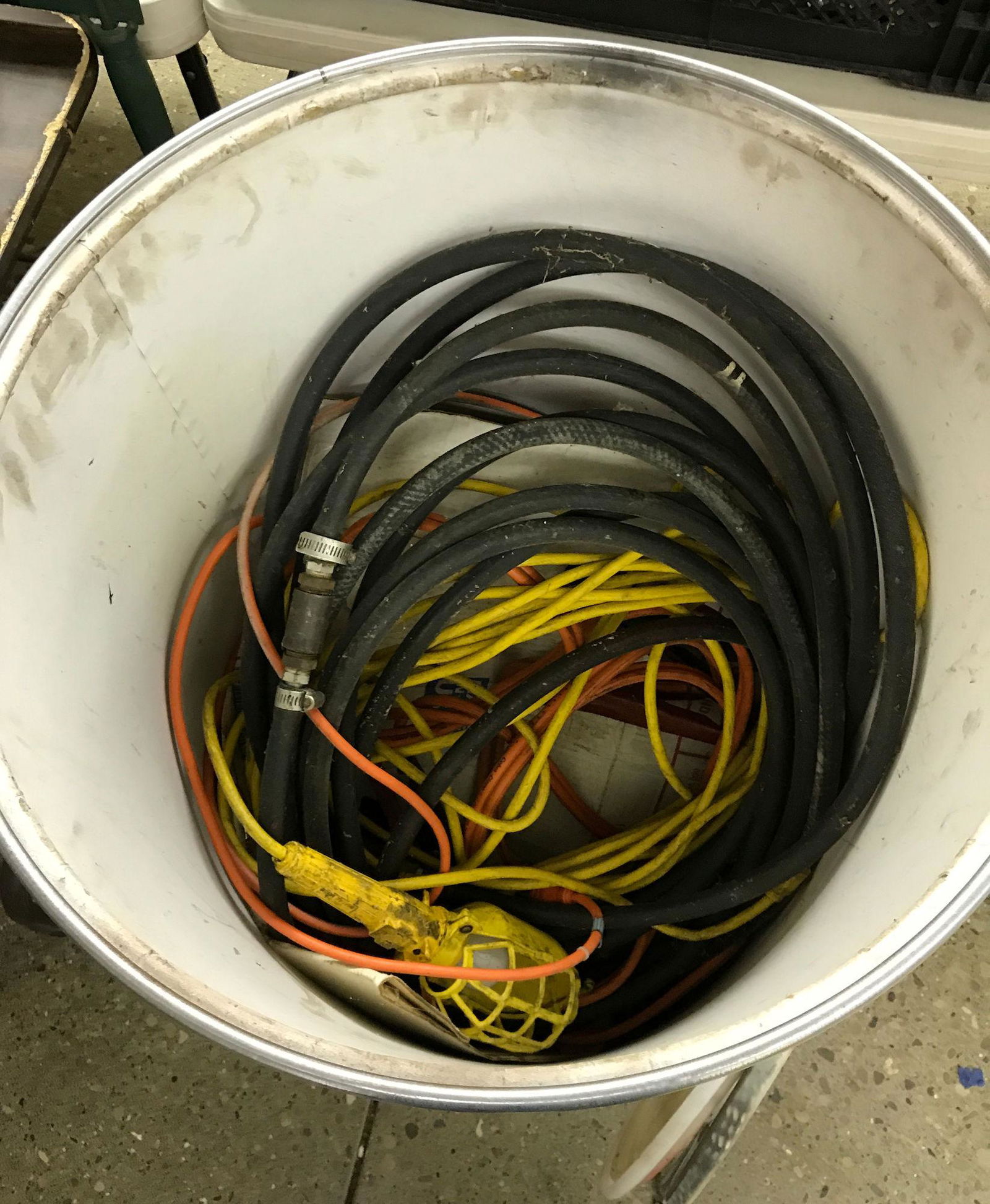 BARREL FILLED WITH AIR HOSES, ELECTRICAL CORDS, AND (1 of 1)
