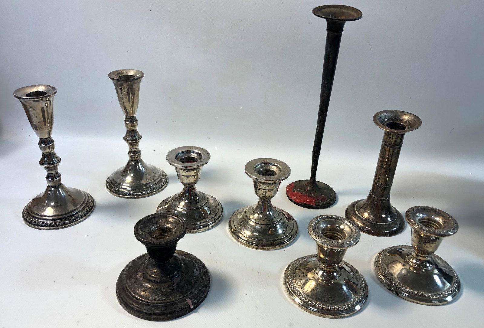 VINTAGE CANDLESTICK BASES: VINTAGE CANDLESTICK BASES ~ STERLING SILVER WEIGHTED AND/OR REINFORCED (PIECES STAMPED). THREE PAIRS AND THREE UNMATCHED PIECES. PCS. FROM FISHER, ROGERS, AND DUCHIN CREATIONS AMONG OTHERS. 2.75" - 10