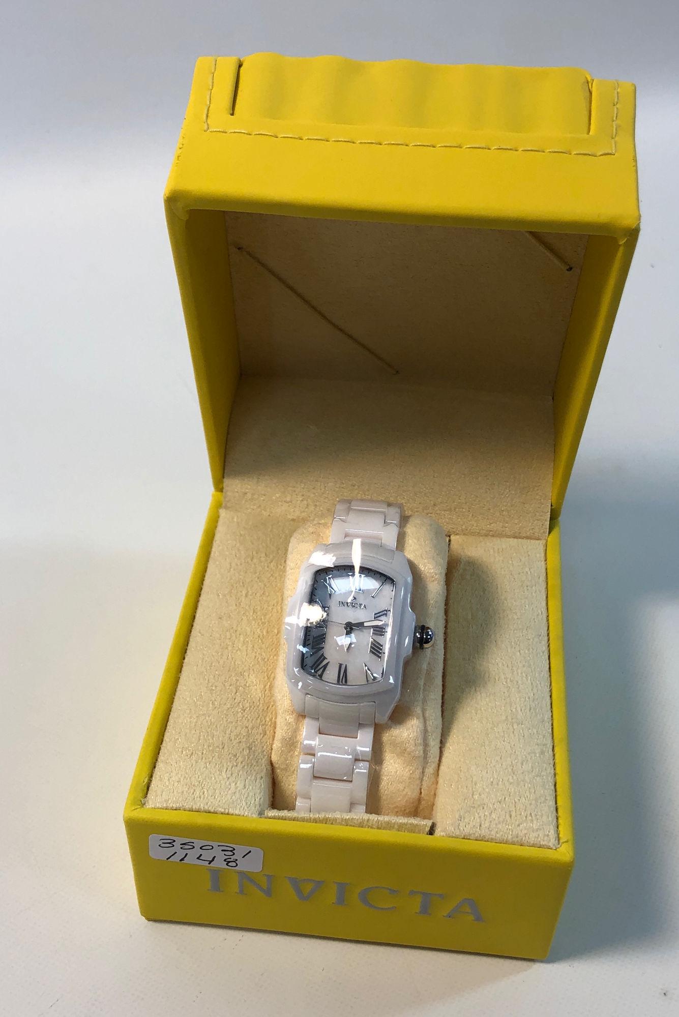 INVICTA WRIST WATCH: INVICTA WRIST WATCH ~ FROM THE "LUPAH" COLLECTION. LIKE NEW. IN ORIGINAL BOX. FLAME FUSION CRYSTAL. SWISS MOVEMENT. SOLID CERAMIC CASE AND BAND (WHITE HUE). MODEL NUMBER 14850. SILVER TONE ROMAN NUMER