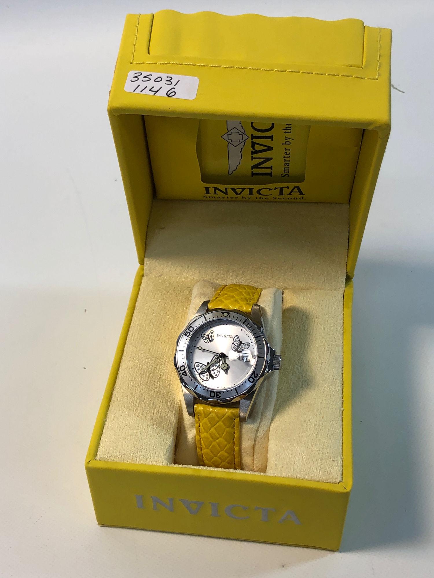 INVICTA WRIST WATCH: INVICTA WRIST WATCH ~ WATER RESISTANT 200M. STAINLESS STEEL CASE/FACE WITH BUTTERFLY MOTIF WITH EACH WING CONTAINING CLEAR CRYSTAL ROUNDS. LIKE NEW. IN ORIGINAL BOX. FLAME FUSION CRYSTAL. SWISS MOVEME