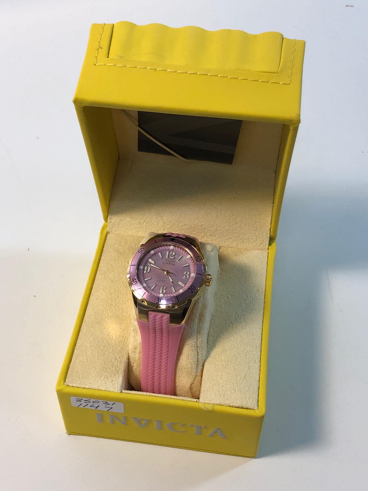 INVICTA WRIST WATCH: INVICTA WRIST WATCH ~ FROM THE ANGEL COLLECTION. GOLD TONE METAL BEZEL WITH PINK NACRE FACE FT. TAPERED HANDS AND INDICATORS AND ROPE STYLE EDGEWORK. LIKE NEW. IN ORIGINAL BOX. FLAME FUSION CRYSTAL. S