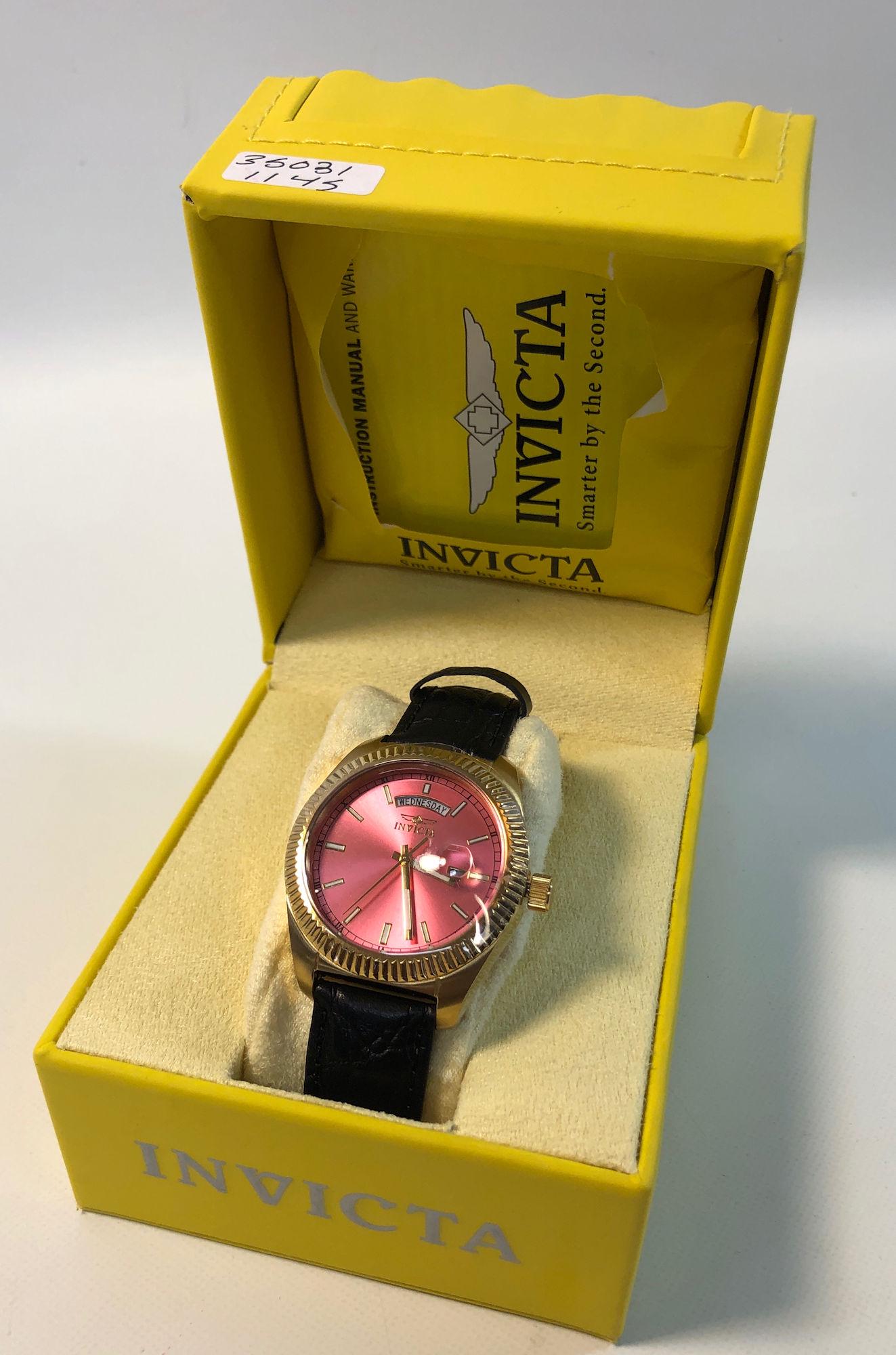 INVICTA WRIST WATCH: INVICTA WRIST WATCH ~ INVICTA "ANGEL" COLLECTION. GOLD TONE METAL CASE (STAINLESS) WITH HOT PINK FACE FT. STRAIGHT HANDS AND INDICATORS. DATE/DAY INDICATOR DIALS ON FACE. LIKE NEW. IN ORIGINAL BOX. FL