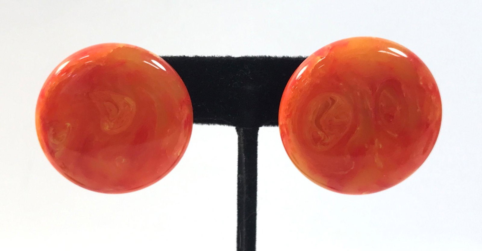 VINTAGE BAKELITE EARRINGS: VINTAGE BAKELITE EARRINGS ~ UNSIGNED, GOLD TONE SNAP BACK CLOSURES, 1.25" IN DIAMETER W/ ORANGE COLOR