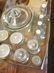 2 BOX LOTS CLEAR GLASS CANISTERS, CORKED BOTTLES,