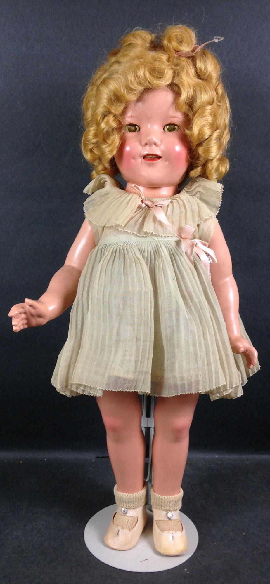18" IDEAL COMPOSITION SHIRLEY TEMPLE DOLL. ALL ORIGINAL: 18" IDEAL COMPOSITION SHIRLEY TEMPLE DOLL. ALL ORIGINAL WITH MOHAIR WIG, SLEEP EYES, OPEN MOUTH WITH TEETH, TAGGED DRESS, UNDERWEAR, CENTER SNAP SHOES AND SOCKS.