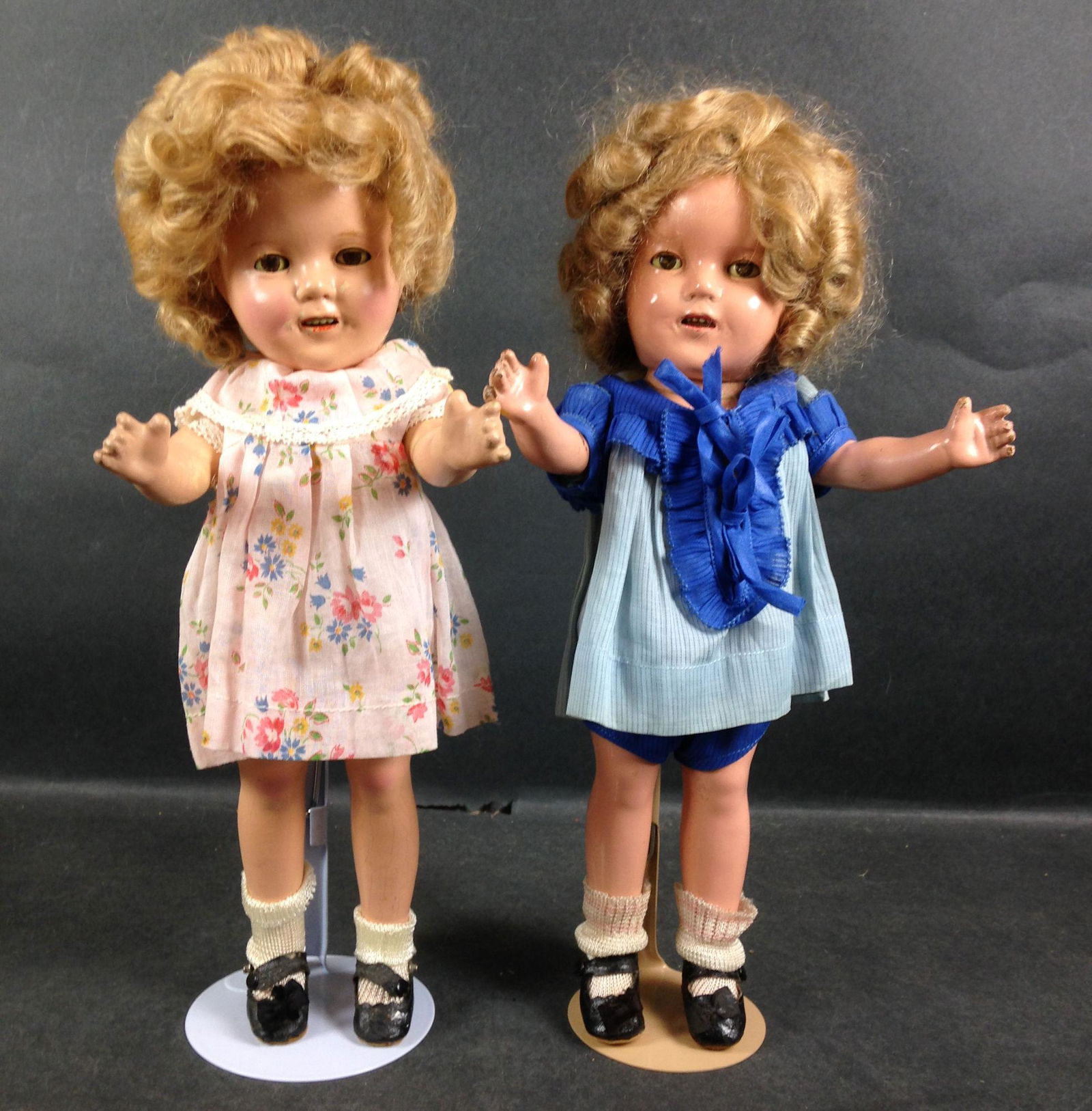 (2) 13" IDEAL COMPOSITION SHIRLEY TEMPLE DOLLS. MOHAIR: (2) 13" IDEAL COMPOSITION SHIRLEY TEMPLE DOLLS. MOHAIR WIGS, SLEEP EYES, OPEN MOUTHS WITH TEETH, ON FIVE PIECE COMPOSITION BODIES.