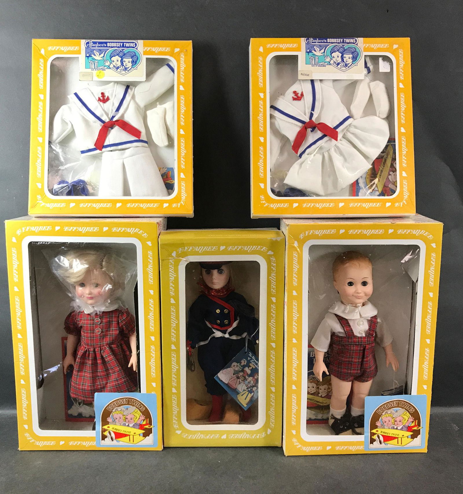 (3) EFFANBEE DOLLS IN ORIGINAL BOXES INCLUDING HANS: (3) EFFANBEE DOLLS IN ORIGINAL BOXES INCLUDING HANS BRINKER AND THE BOBBSEY TWINS "FLOSSIE" & "FREDDIE" WITH (2) BOXED "GO A'SAILING" MATCHING OUTFITS. ALL HAVE ORIGINAL HANG TAGS.