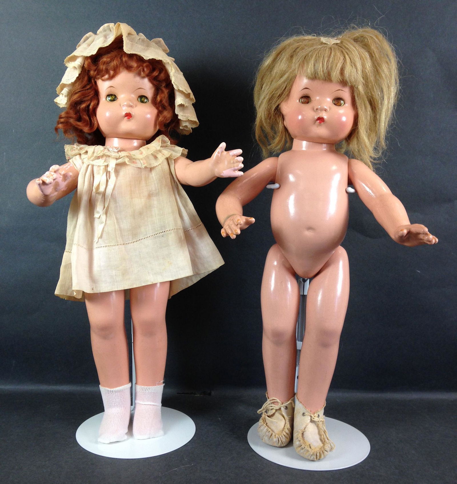 (2) 19" EFFANBEE COMPOSITION PATSY-ANN DOLLS. BOTH WITH: (2) 19" EFFANBEE COMPOSITION PATSY-ANN DOLLS. BOTH WITH WIGS OVER MOLDED HAIR, SLEEP EYES, CLOSED MOUTHS. FIRST DOLL HAS RED MOHAIR WIG AND WEARS ORIGINAL DRESS AND HAT. SECOND DOLL HAS HUMAN HAIR WIG